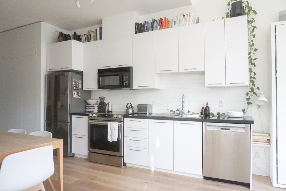 A rare wide angle shot of our home. You can see where the fridge lines up with the entryway closets. Previously our fridge stuck out about 5 past the countertop into the apartment.