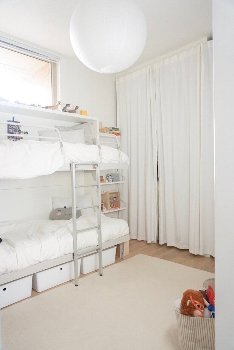A rarely shown view of our master closet with floor to ceiling curtains to conceal it and soften the room. See also, stuffies with washi tape masks, one of the kids favourite past-times.
