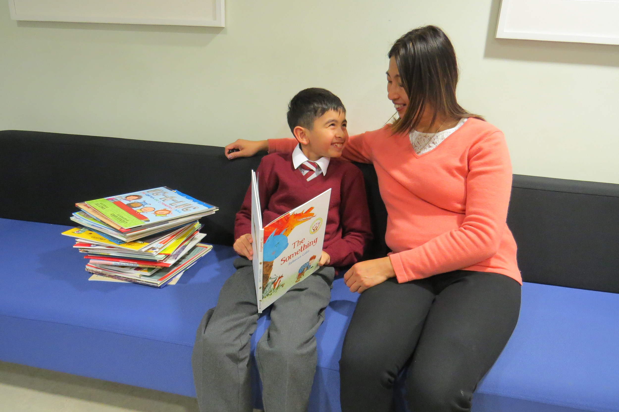 Young patient Luis Fafian and his mother Samorn Chimkeaw read one of the books donated to the Royal Brompton Hospital during an out-patient appointment in the inherited cardiac conditions clinic