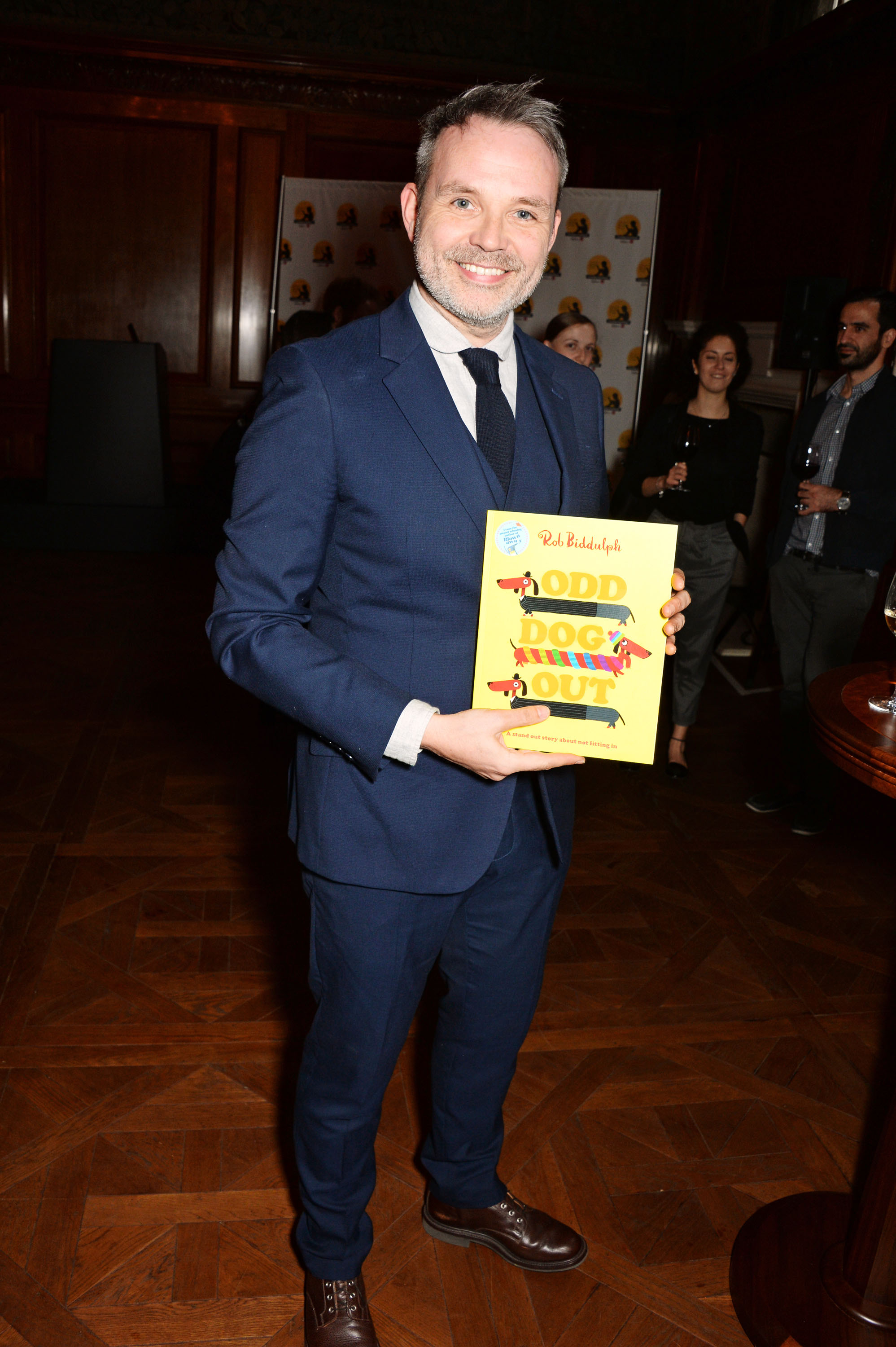 Author and illustrator Rob Biddulph with Odd Dog Out, one of the five books shortlisted for the 2017 Oscar's Book Prize. (Photo: Dave Benett)