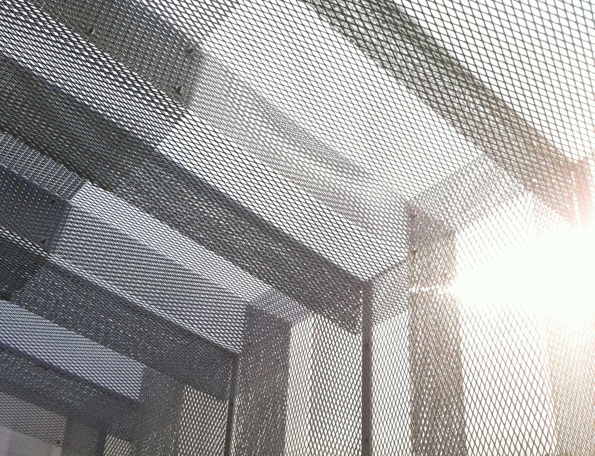 Abstract hues of light and shadow create geometric patterns in the sky