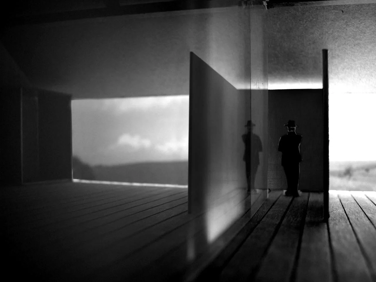 Gallery Entrance the progression to the gallery is enclosed between the steel wall and etched glass. the reflection of the wall in the glass embraces the visitor's approach.