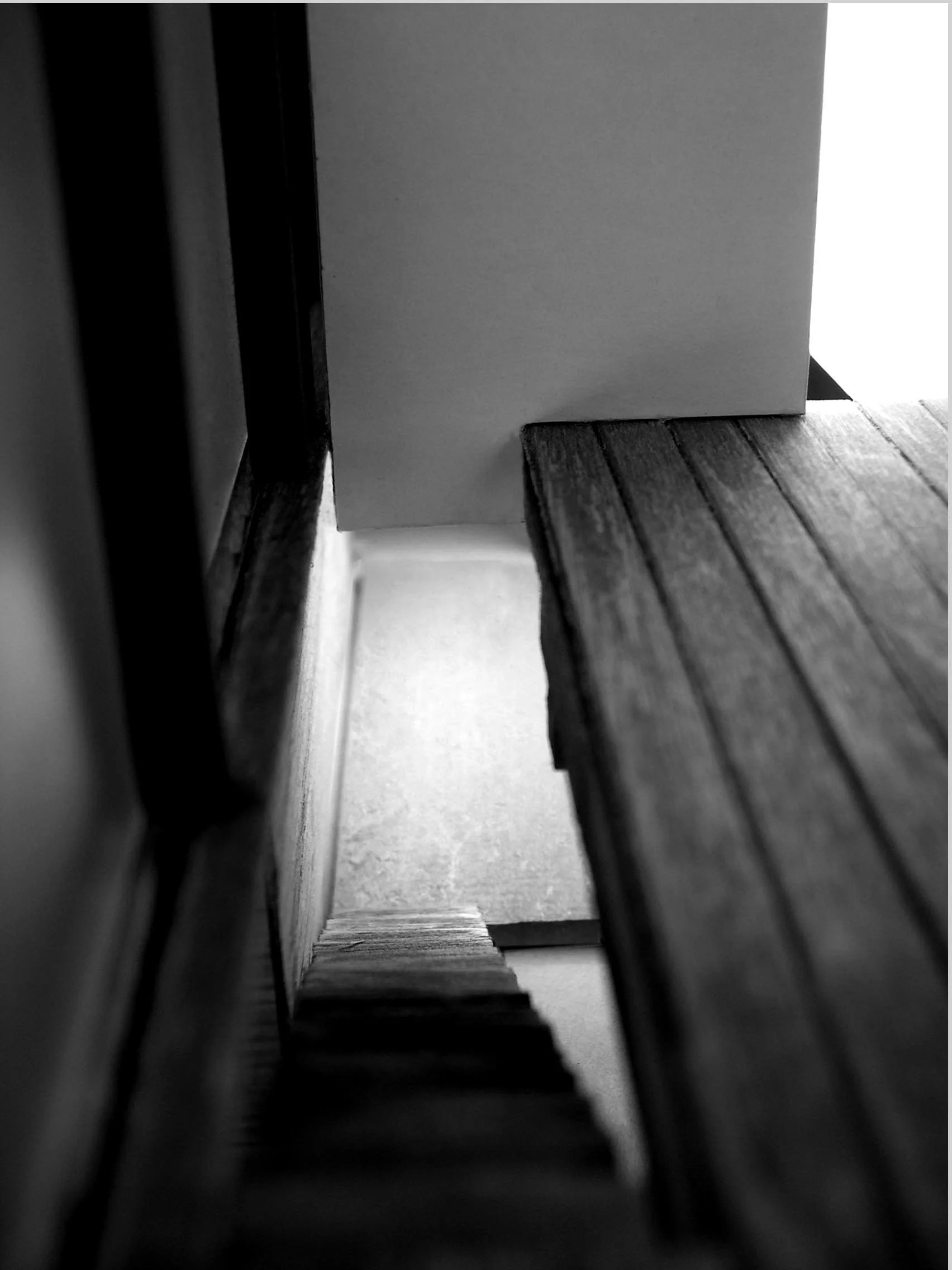 Descent the stairway to the workspace below leaves the traveler standing within the volume of the light well above.