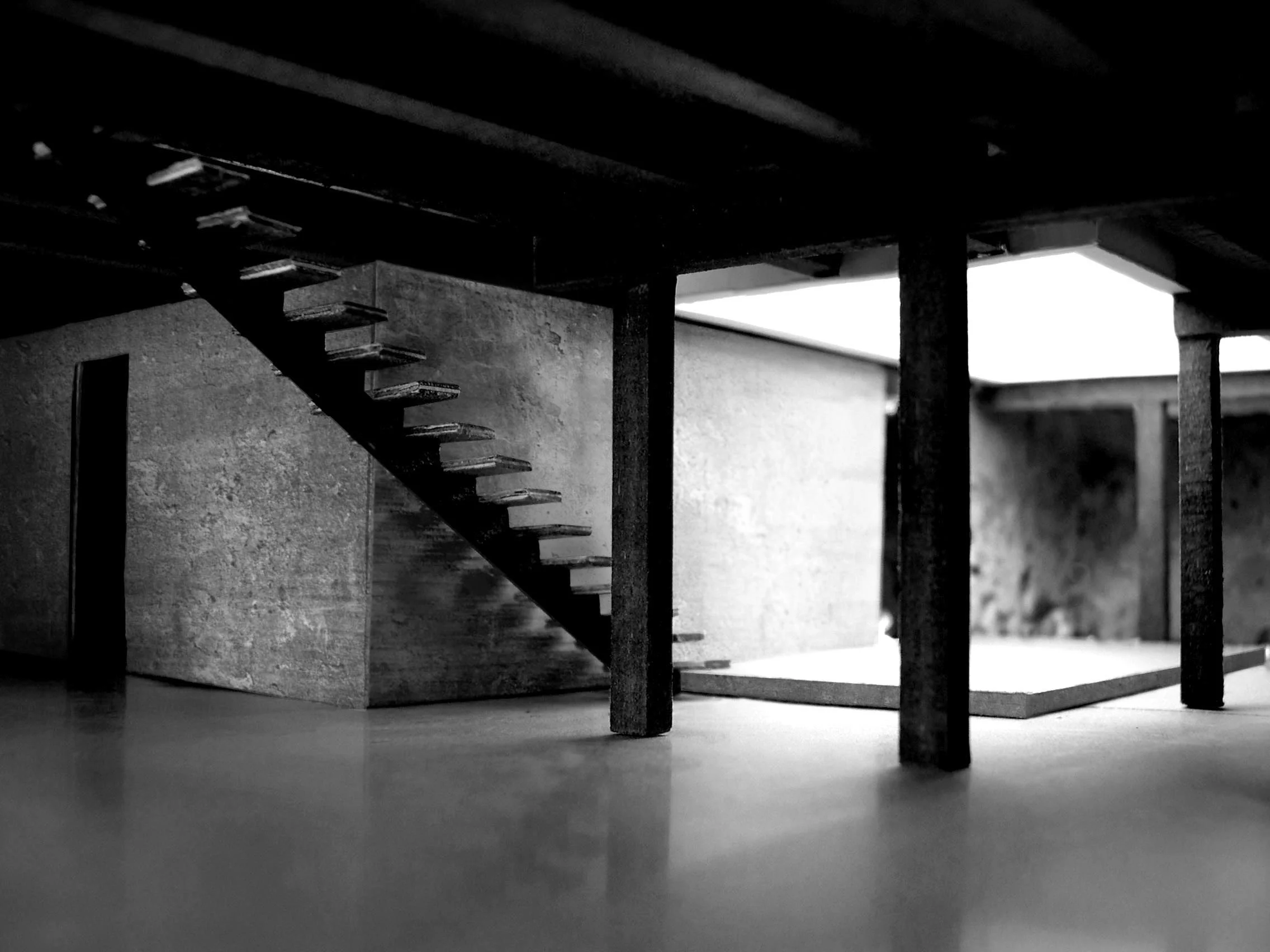 Workspace the light well releases its contained light deep within the workspace, creating a soft ambiance that floats in a realm of shadows.