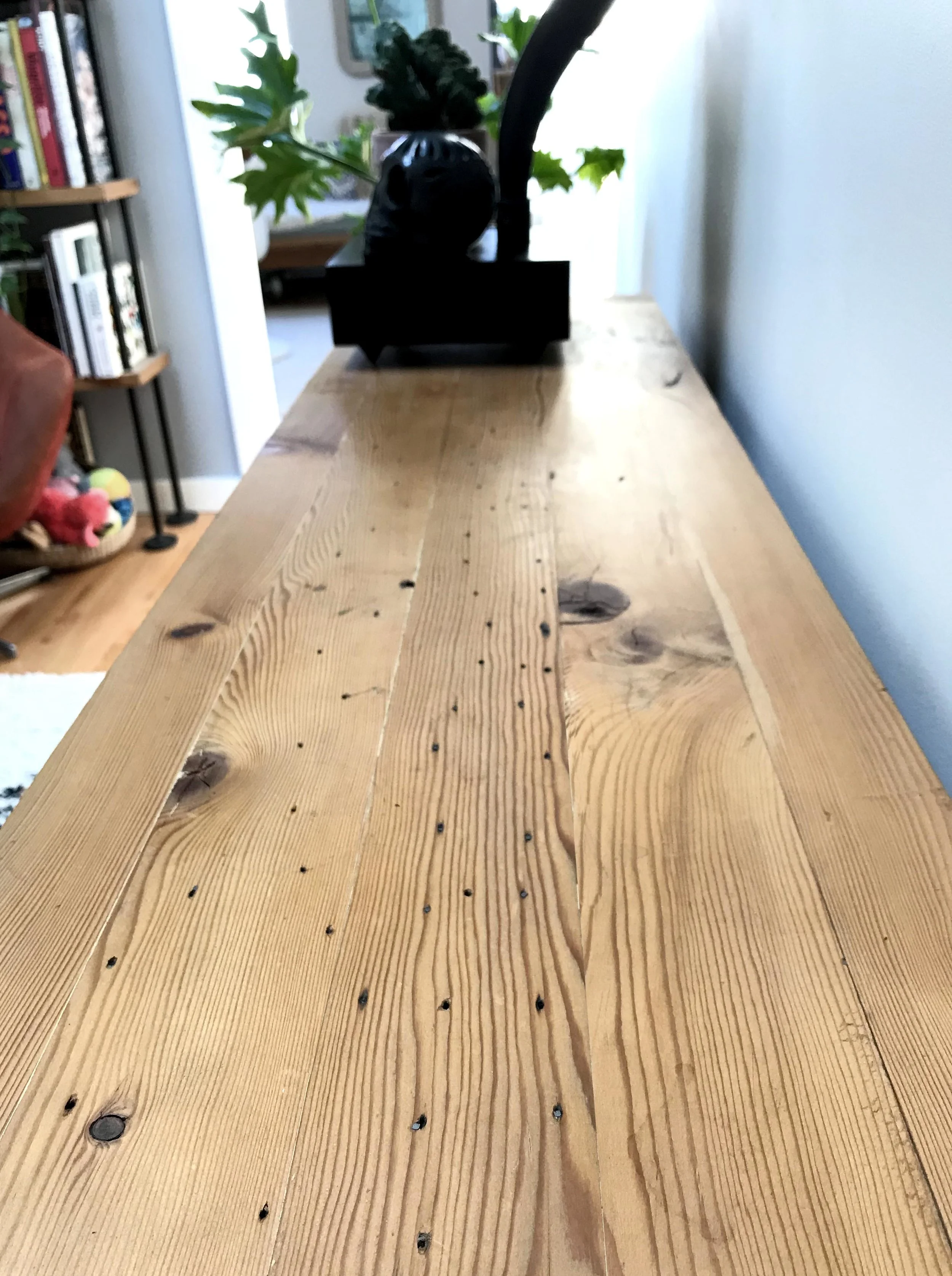 Surface holes and stains from a life of service give the surface a richness and tactility