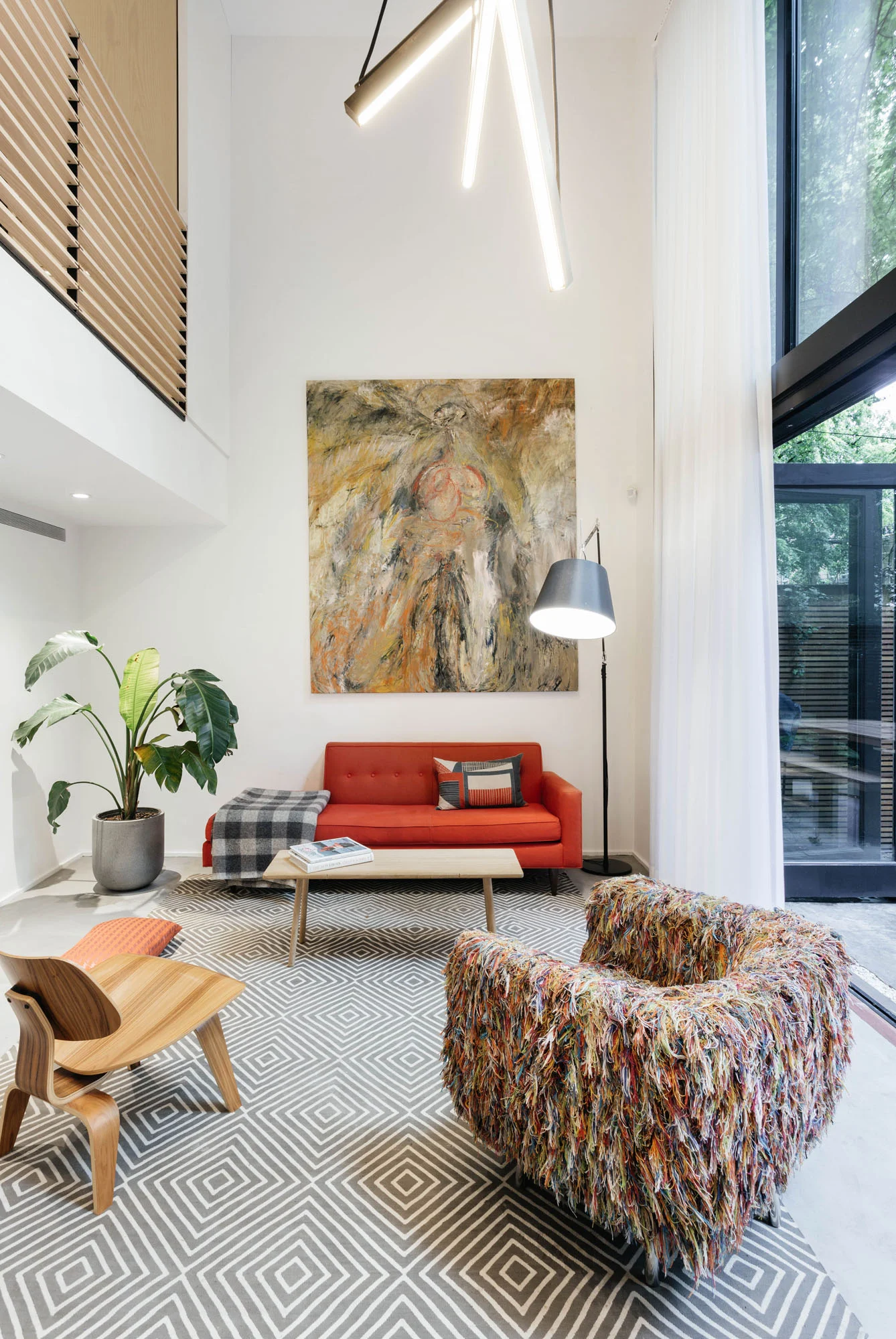   Volume/Light   Large windows and folding glass doors flood the large volume with an airy light 