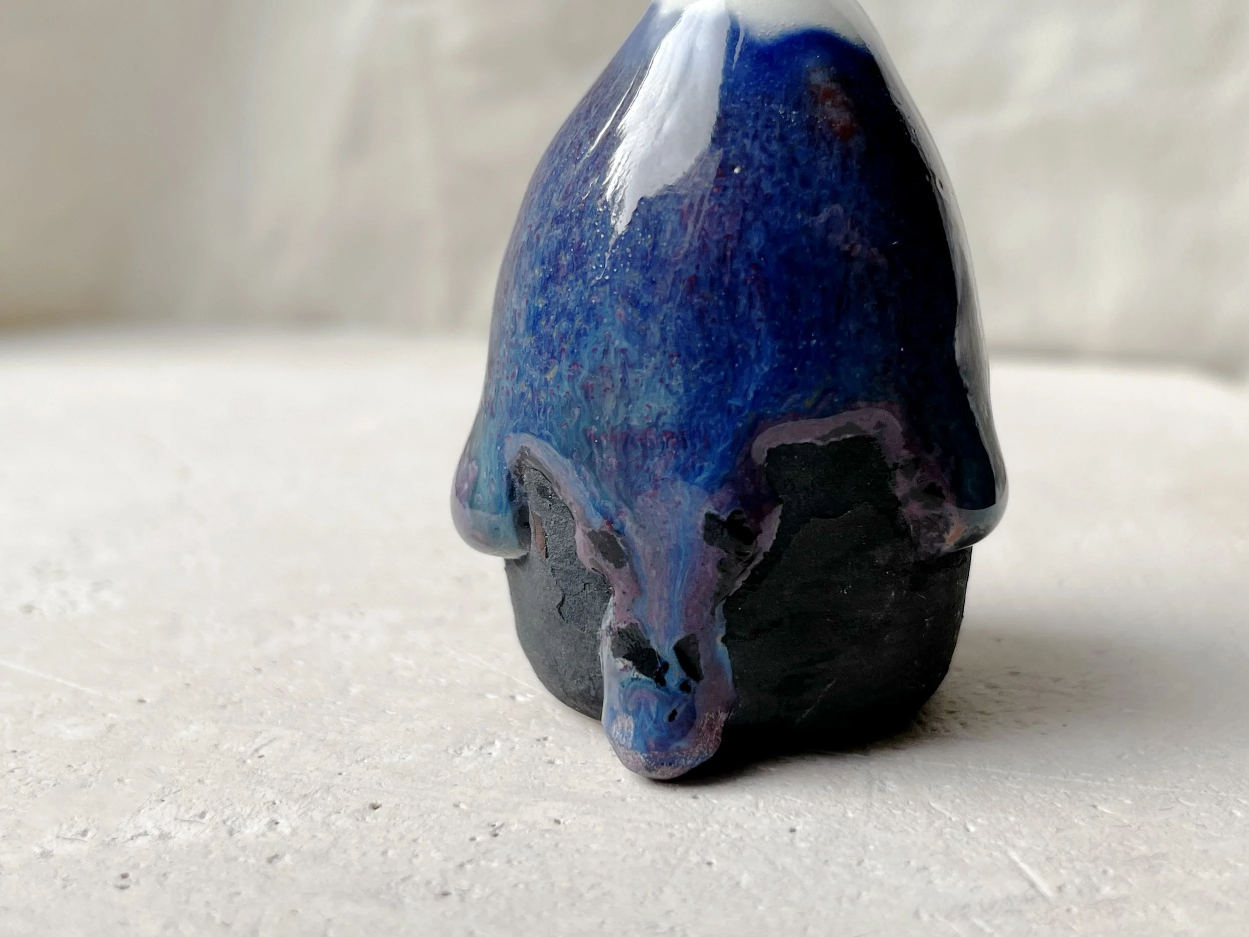 blue purple black handmade figurative ceramic sculpture with glossy floating glaze