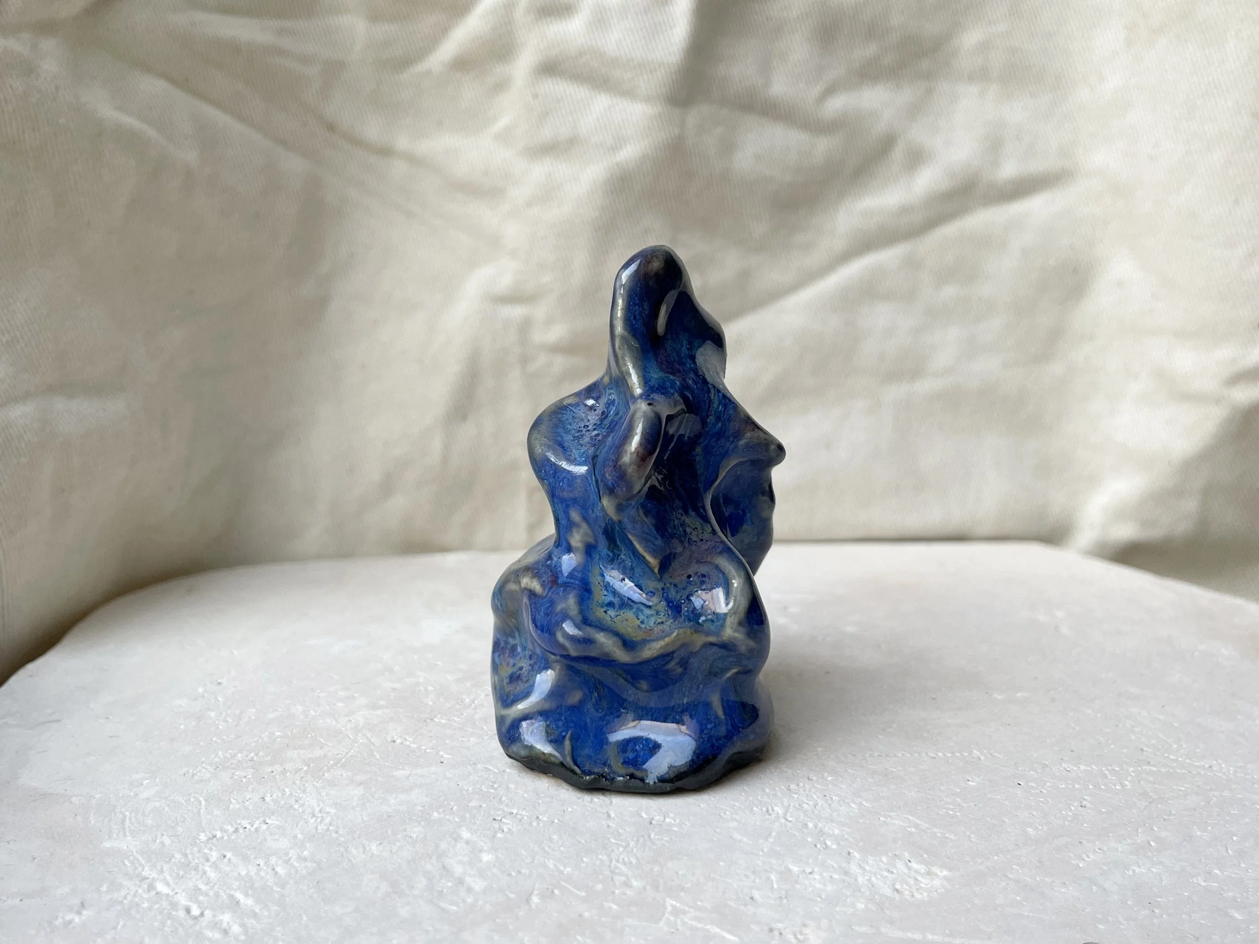 Wavy blue and red handmade figurative ceramic sculpture with glossy floating glaze and underglaze