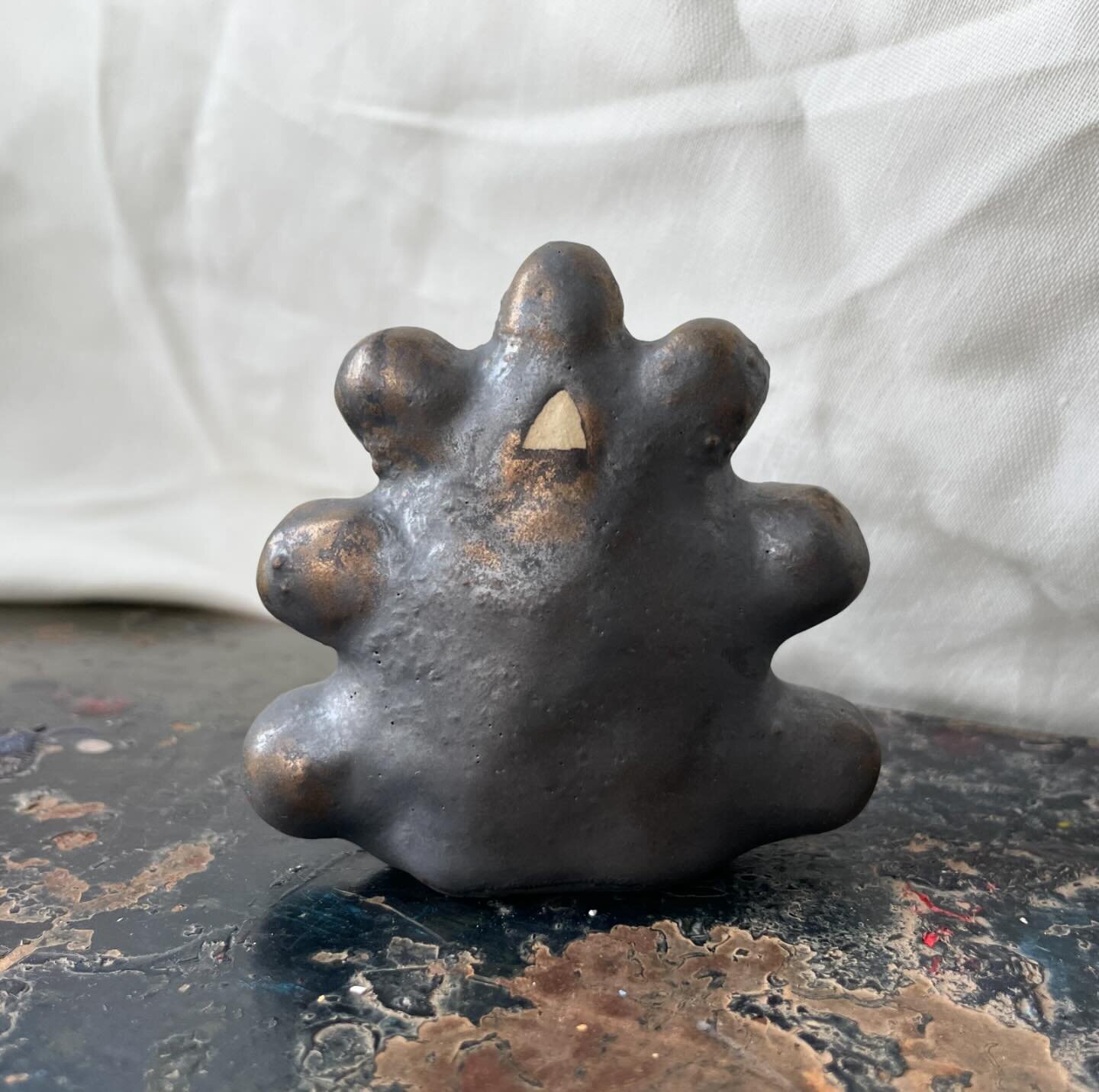 Textures bumps and feelings you can hold in your hands. Stoneware and metallic glaze #clay #touch