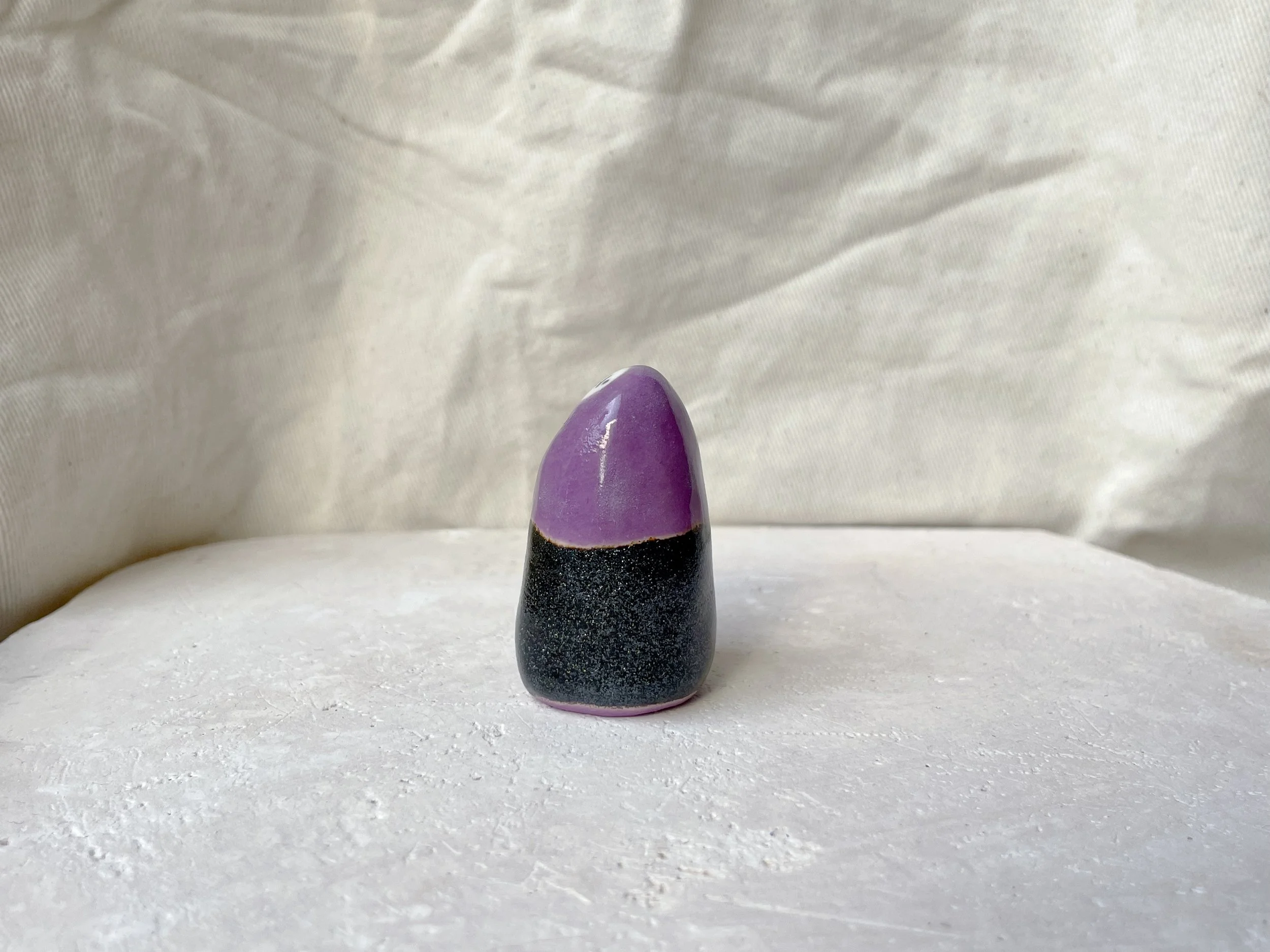 Purple and black sparkly handmade figurative ceramic sculpture with glittery glaze