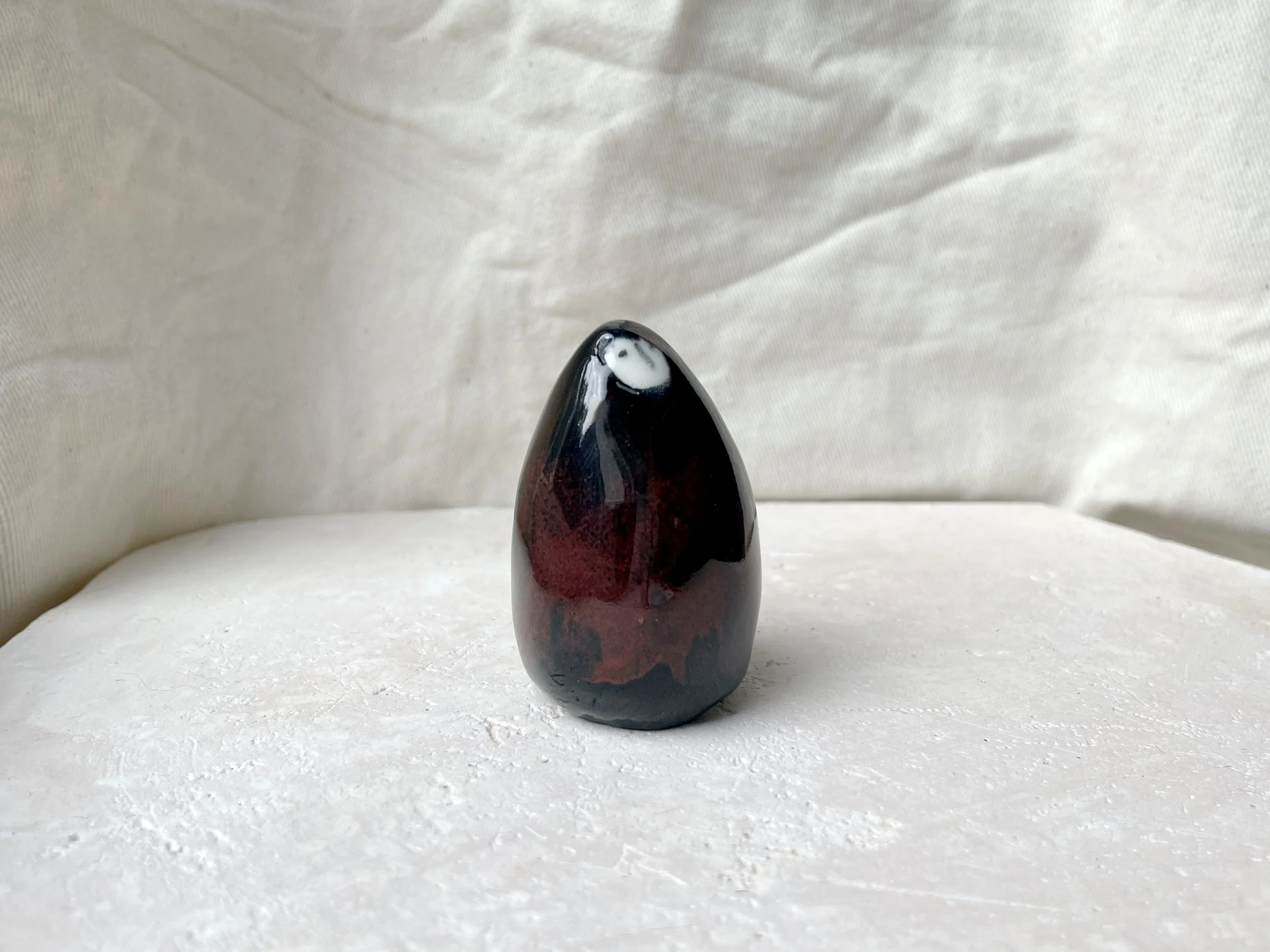 black and red handmade figurative ceramic sculpture with underglaze and floating glaze