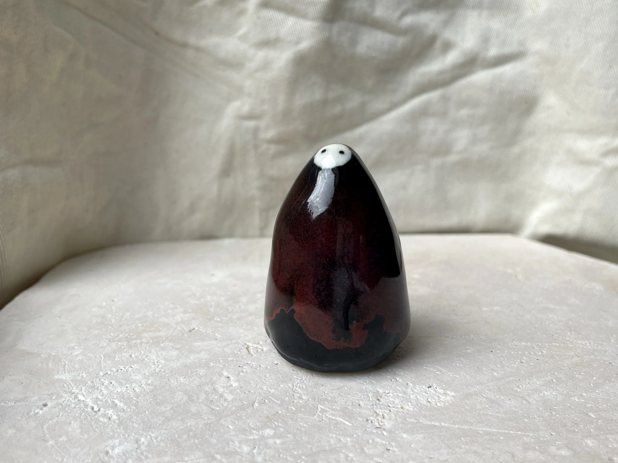 black and red handmade figurative ceramic sculpture with underglaze and floating glaze