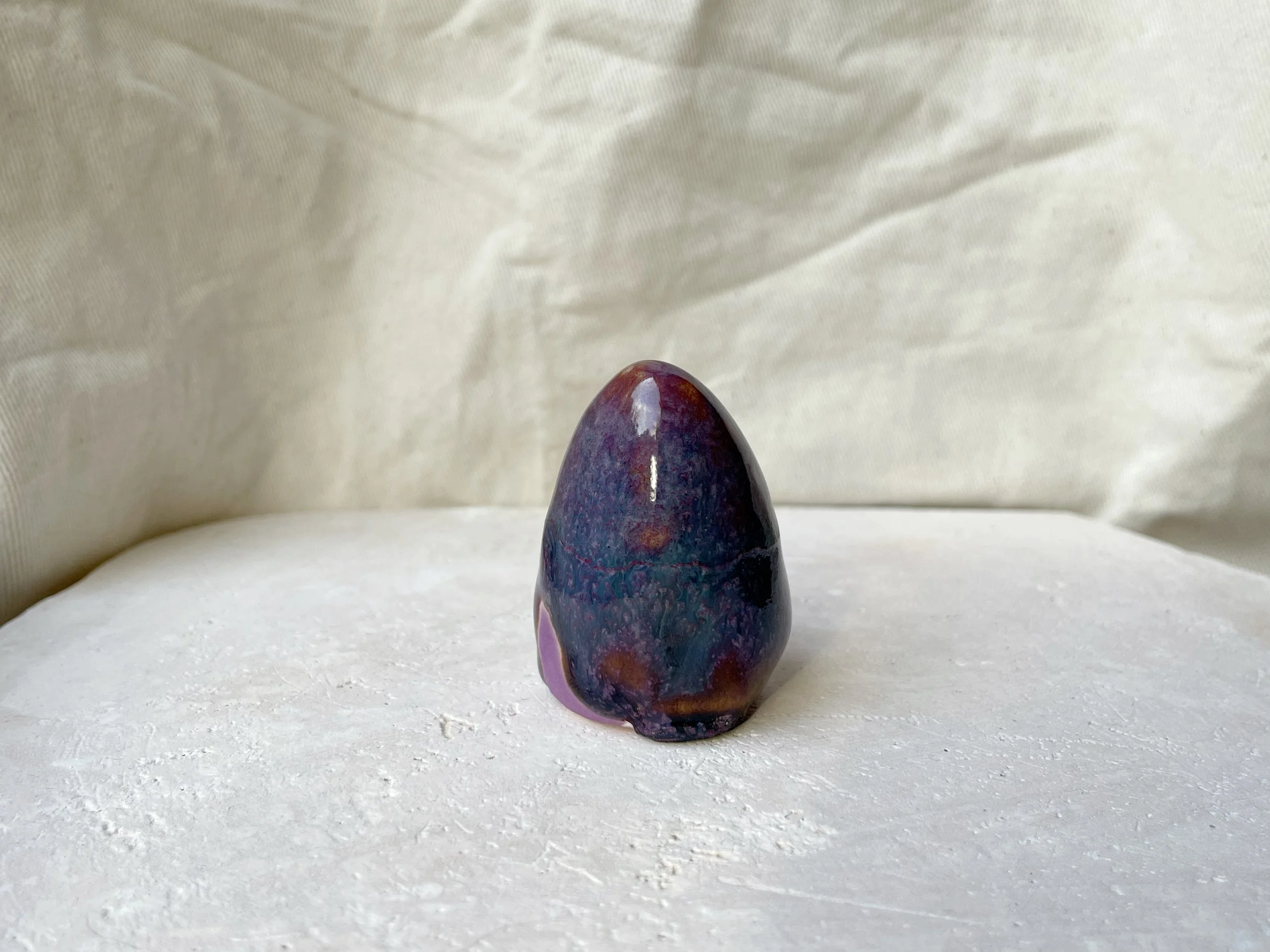 Purple, lilac and red handmade figurative ceramic sculpture with glossy drippy glaze