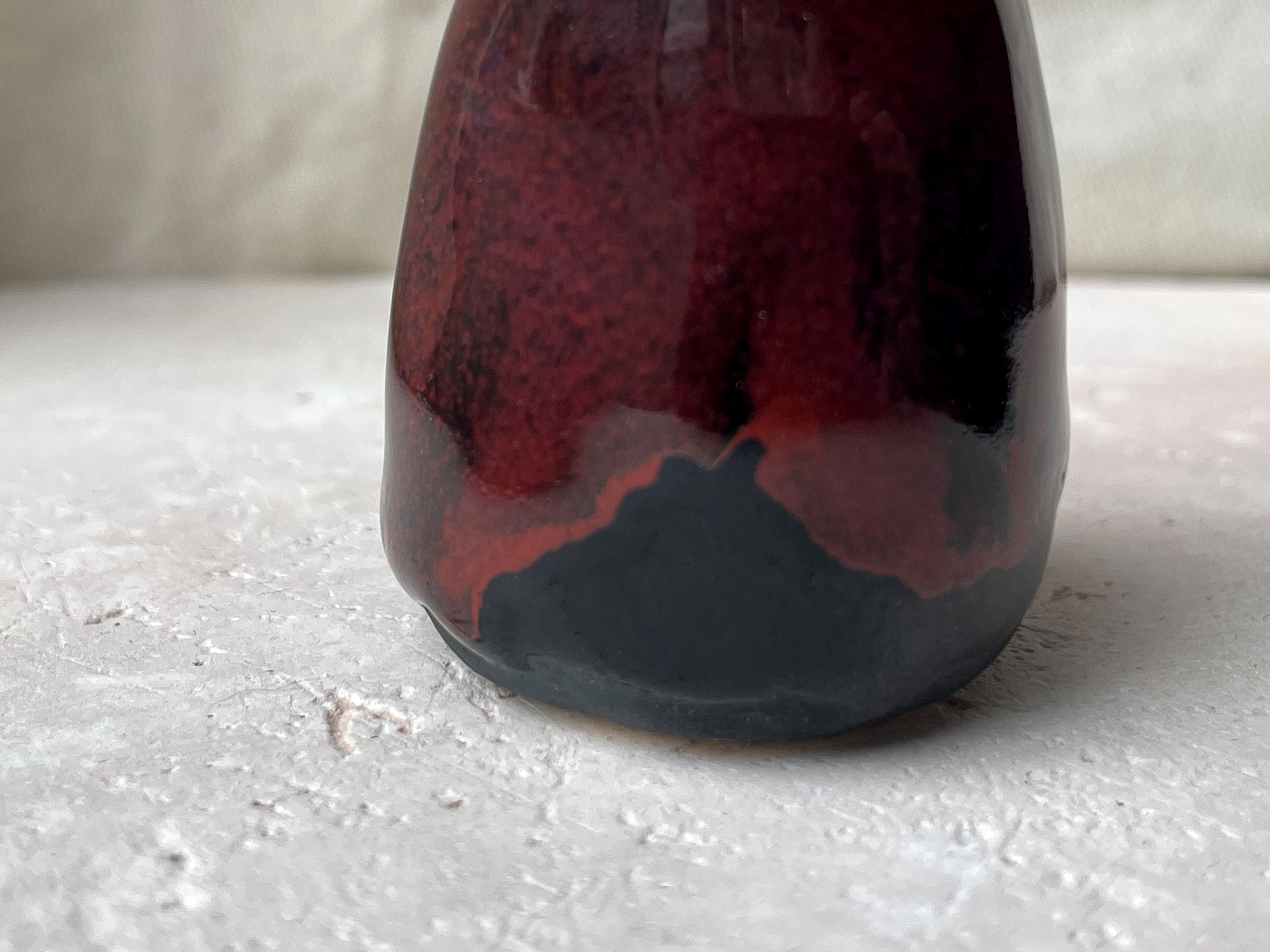 black and red handmade figurative ceramic sculpture with underglaze and floating glaze