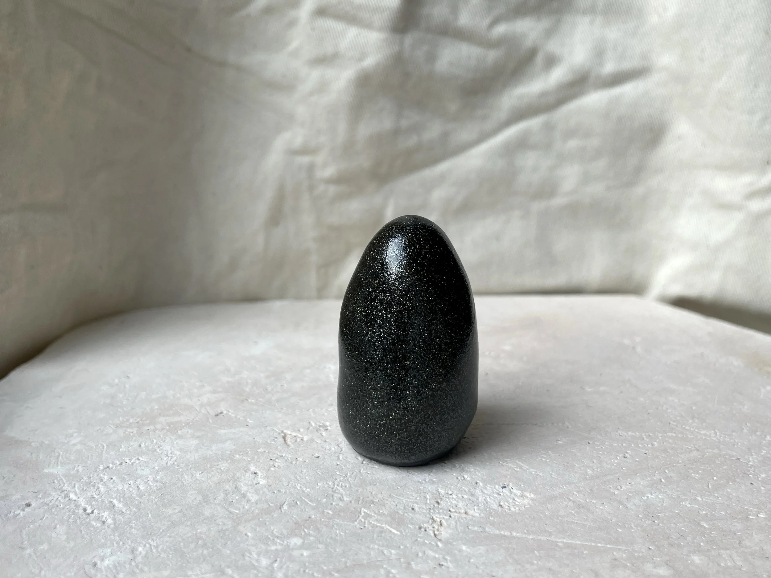 black sparkly handmade figurative ceramic sculpture with glittery glaze
