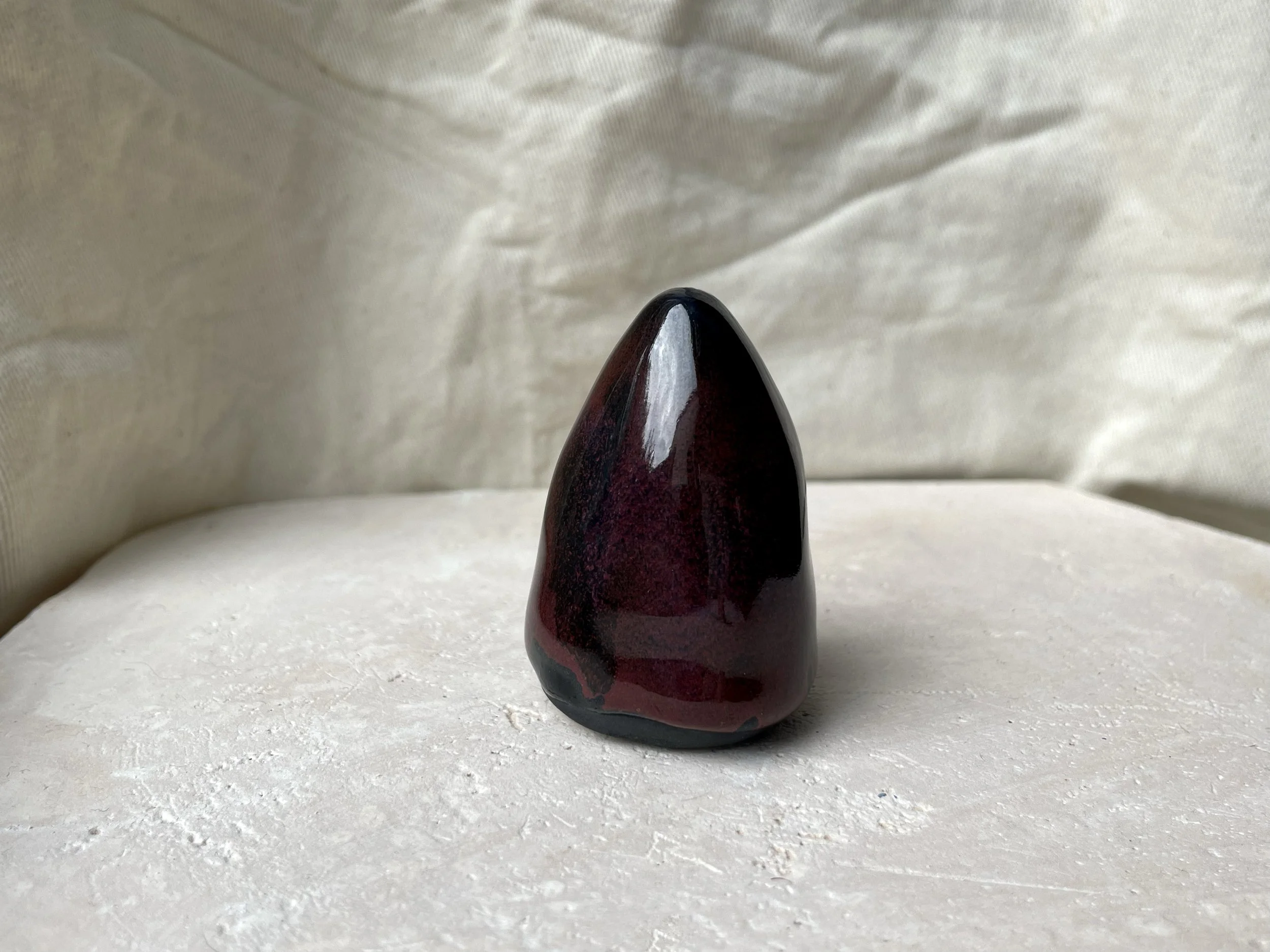 black and red handmade figurative ceramic sculpture with underglaze and floating glaze