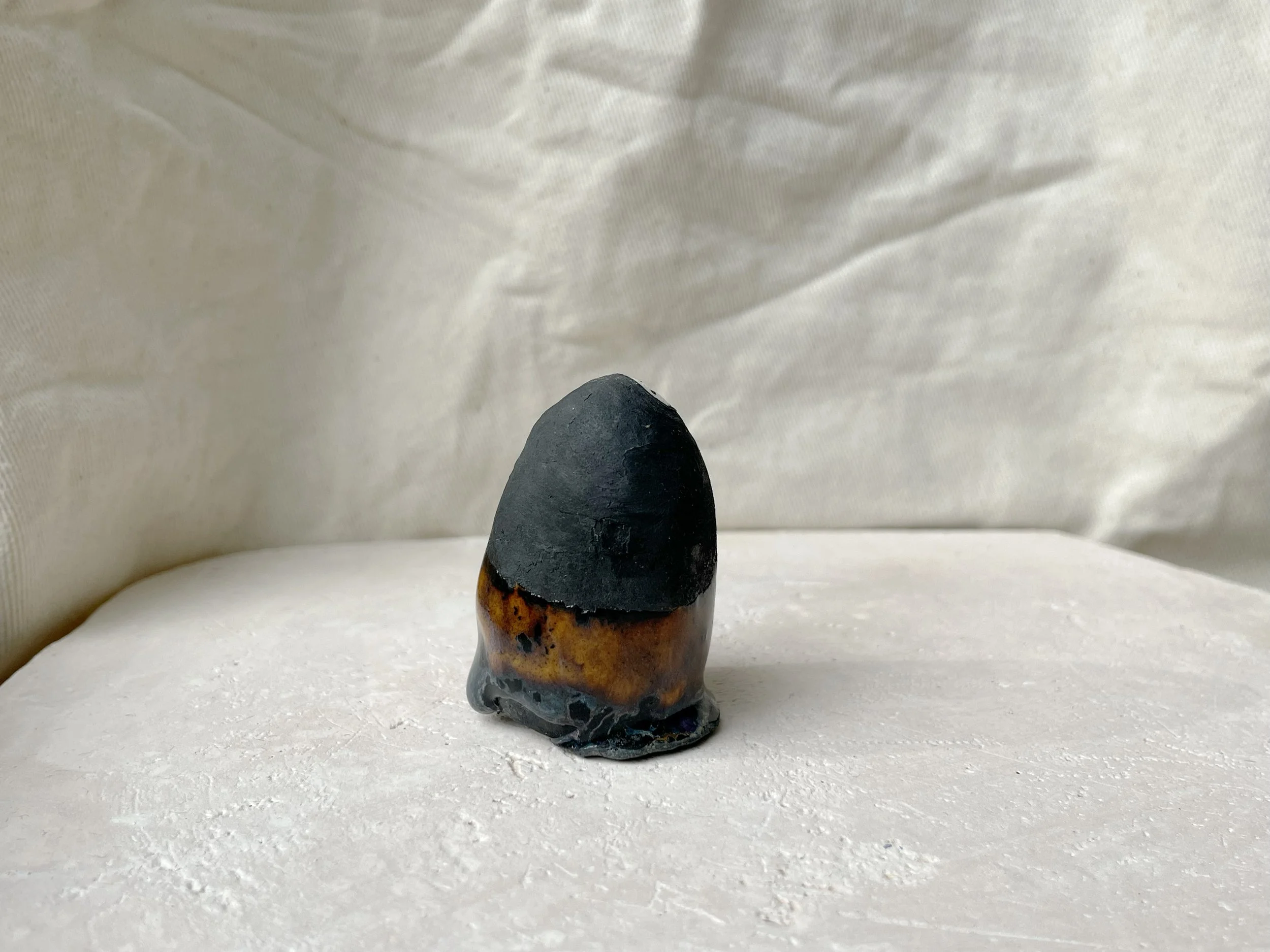 black and brown handmade figurative ceramic sculpture with matt and runny glaze