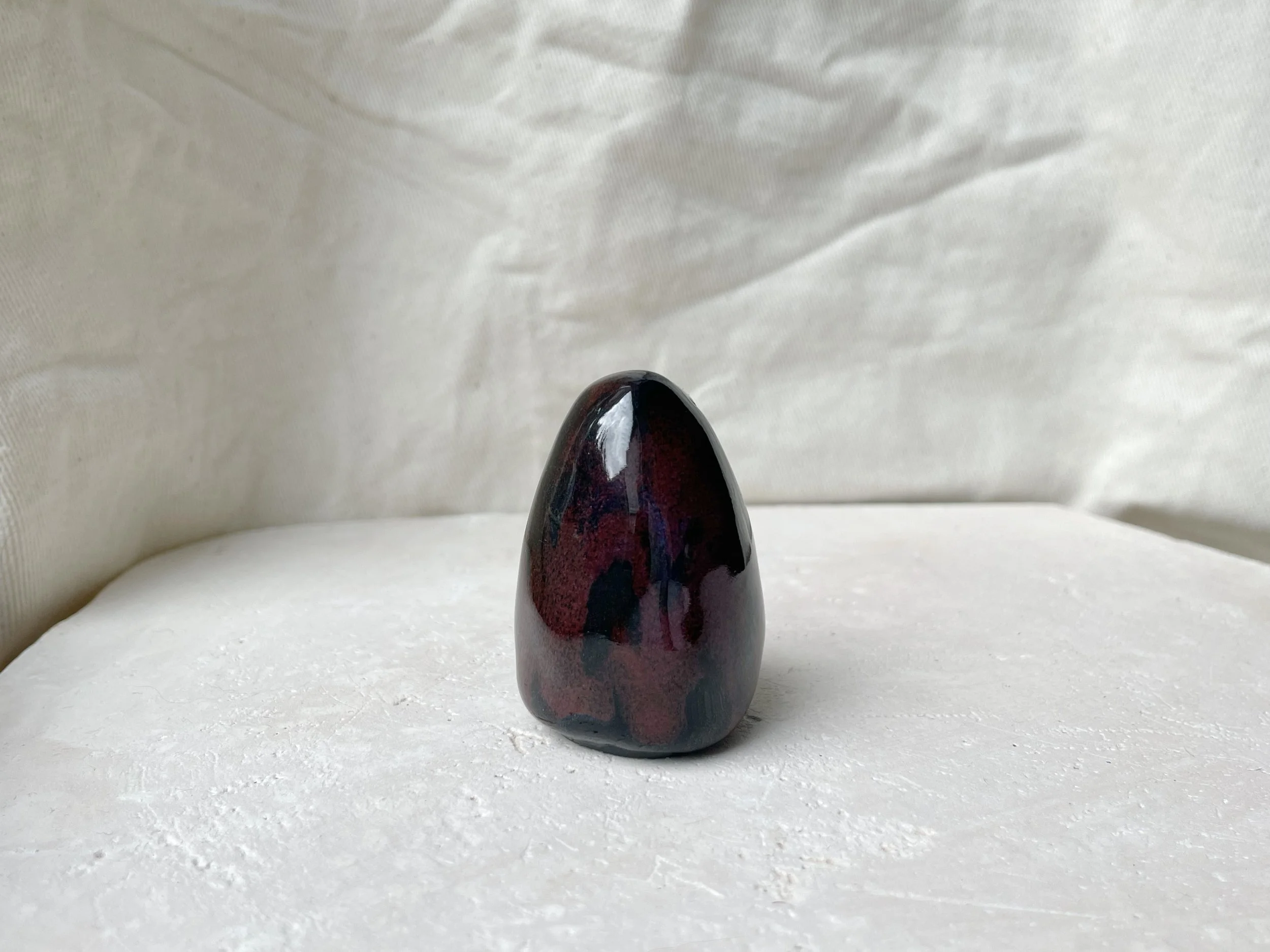 black and red handmade figurative ceramic sculpture with underglaze and floating glaze