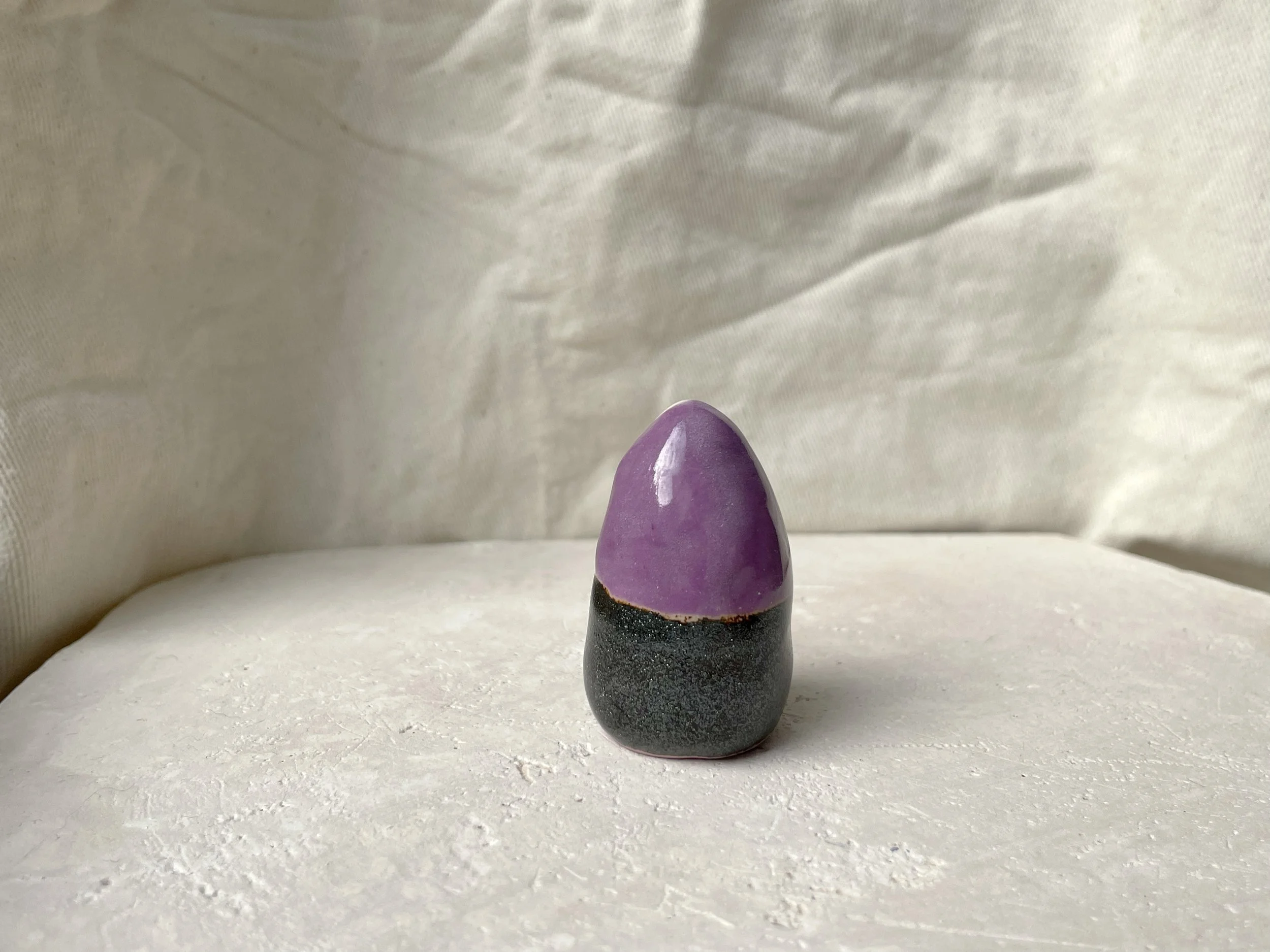 Purple and sparkly black handmade figurative ceramic sculpture with underglaze and glaze