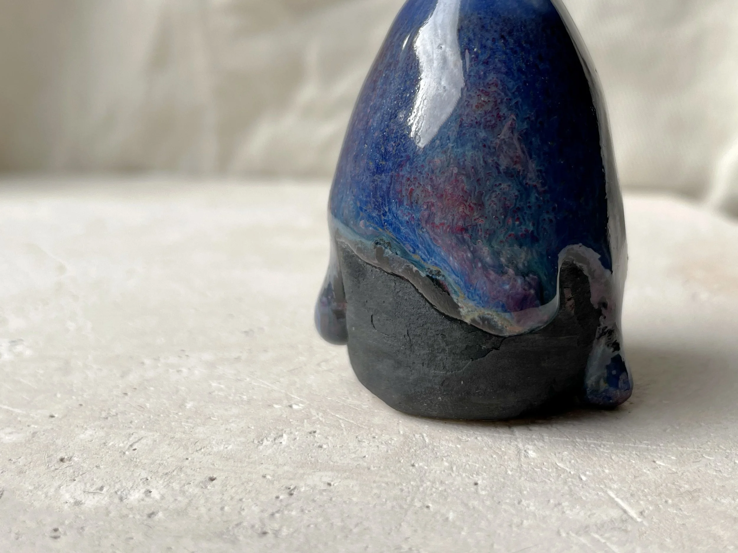 blue purple black handmade figurative ceramic sculpture with glossy floating glaze