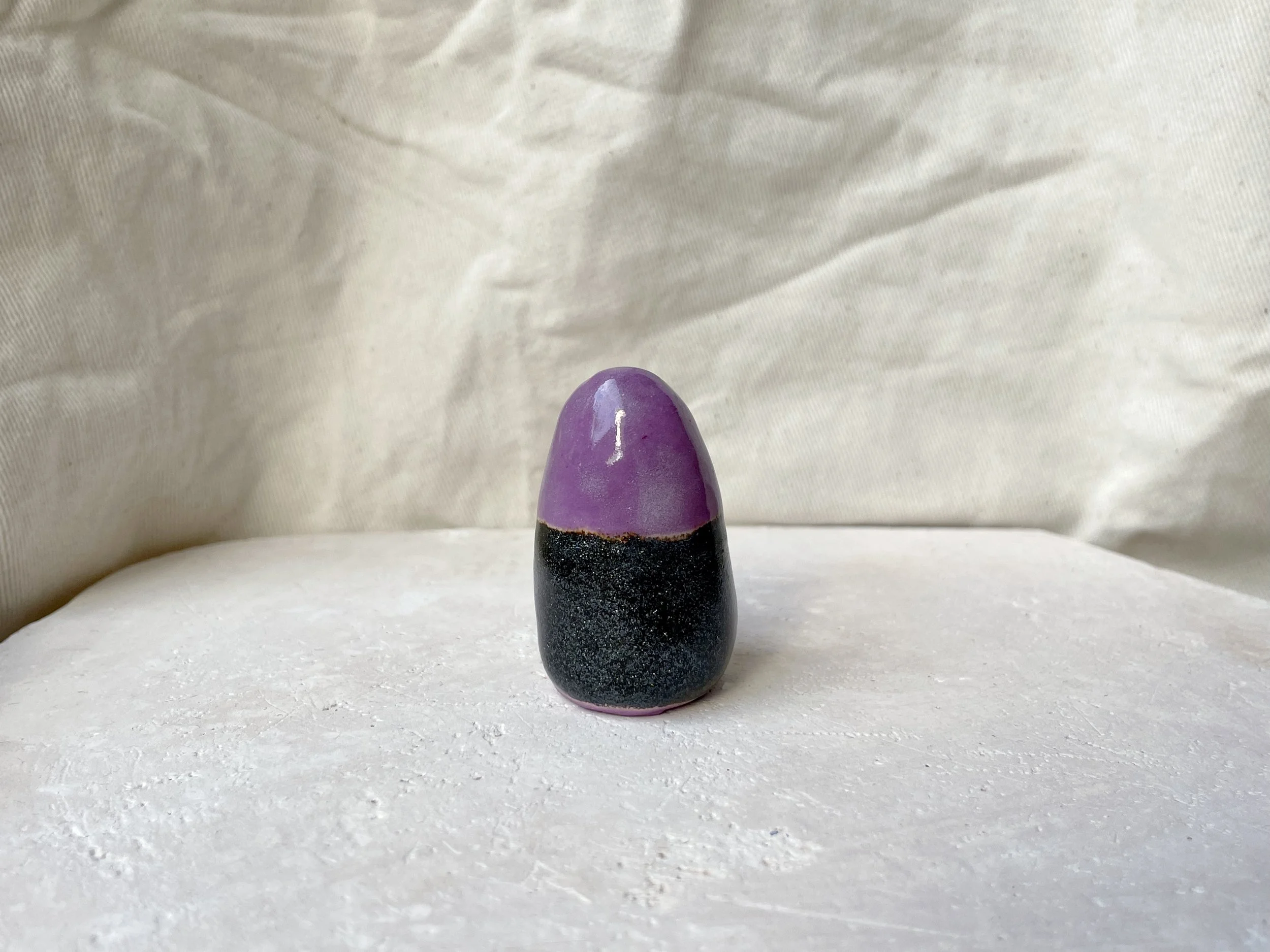 Purple and black sparkly handmade figurative ceramic sculpture with glittery glaze