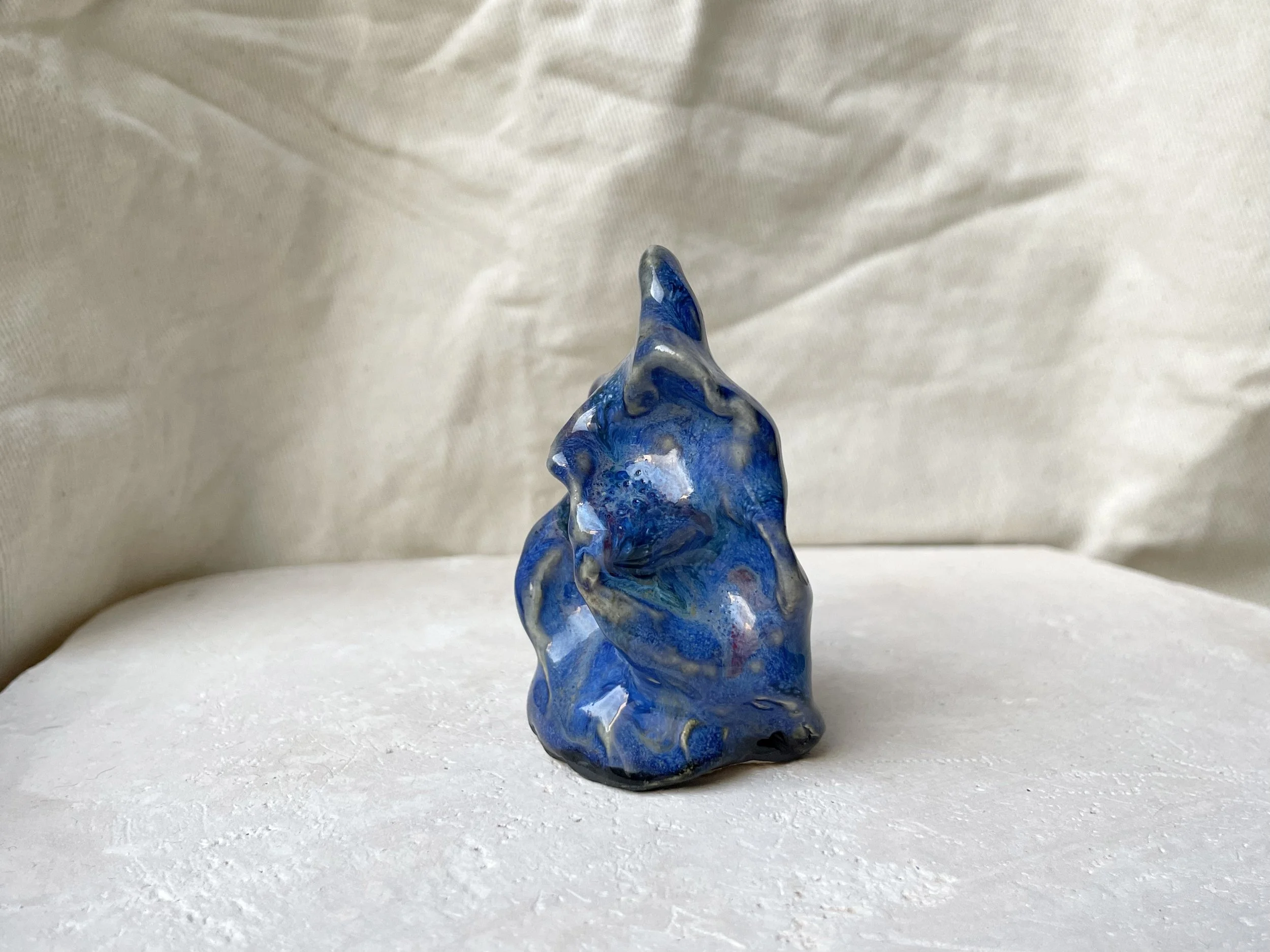 Wavy blue and red handmade figurative ceramic sculpture with glossy floating glaze and underglaze