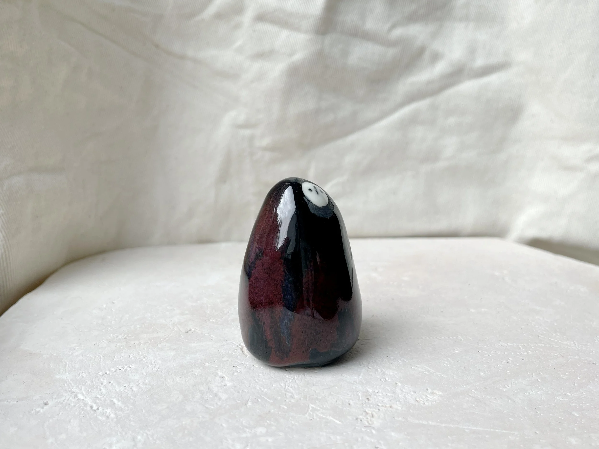 black and red handmade figurative ceramic sculpture with underglaze and floating glaze