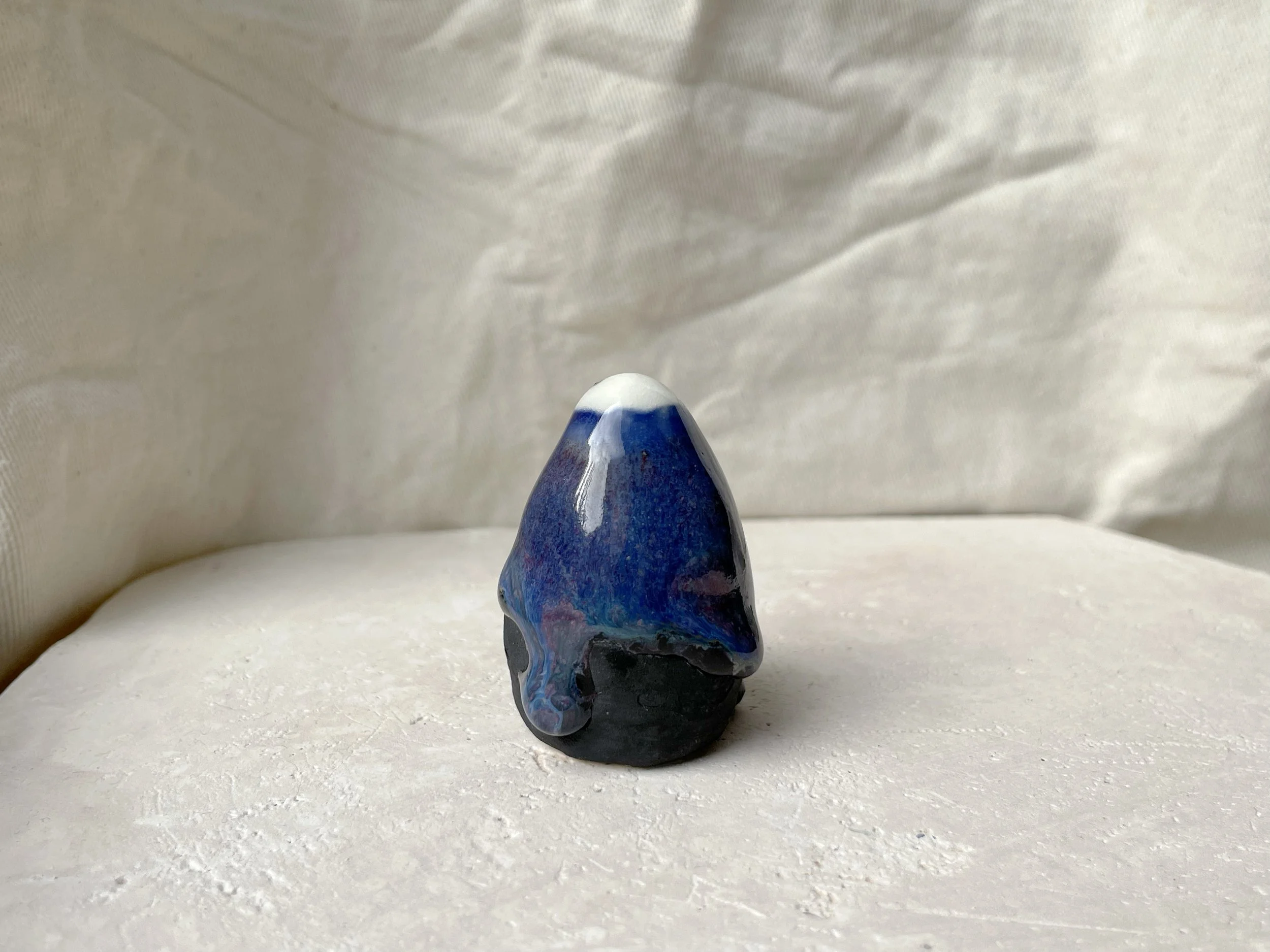 blue purple black handmade figurative ceramic sculpture with glossy floating glaze