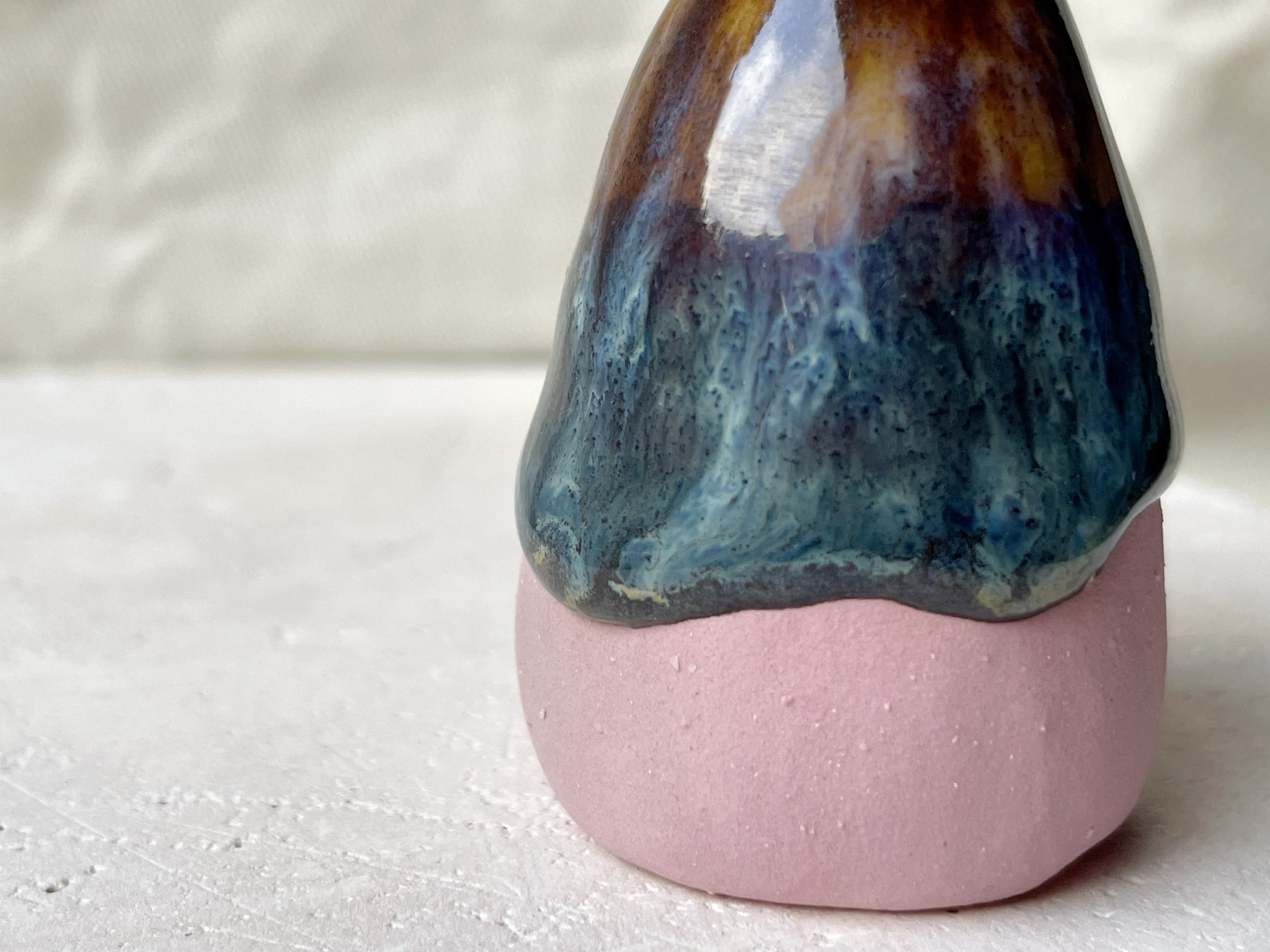 Pink, brown and green and cream handmade figurative ceramic sculpture with glossy drippy glaze