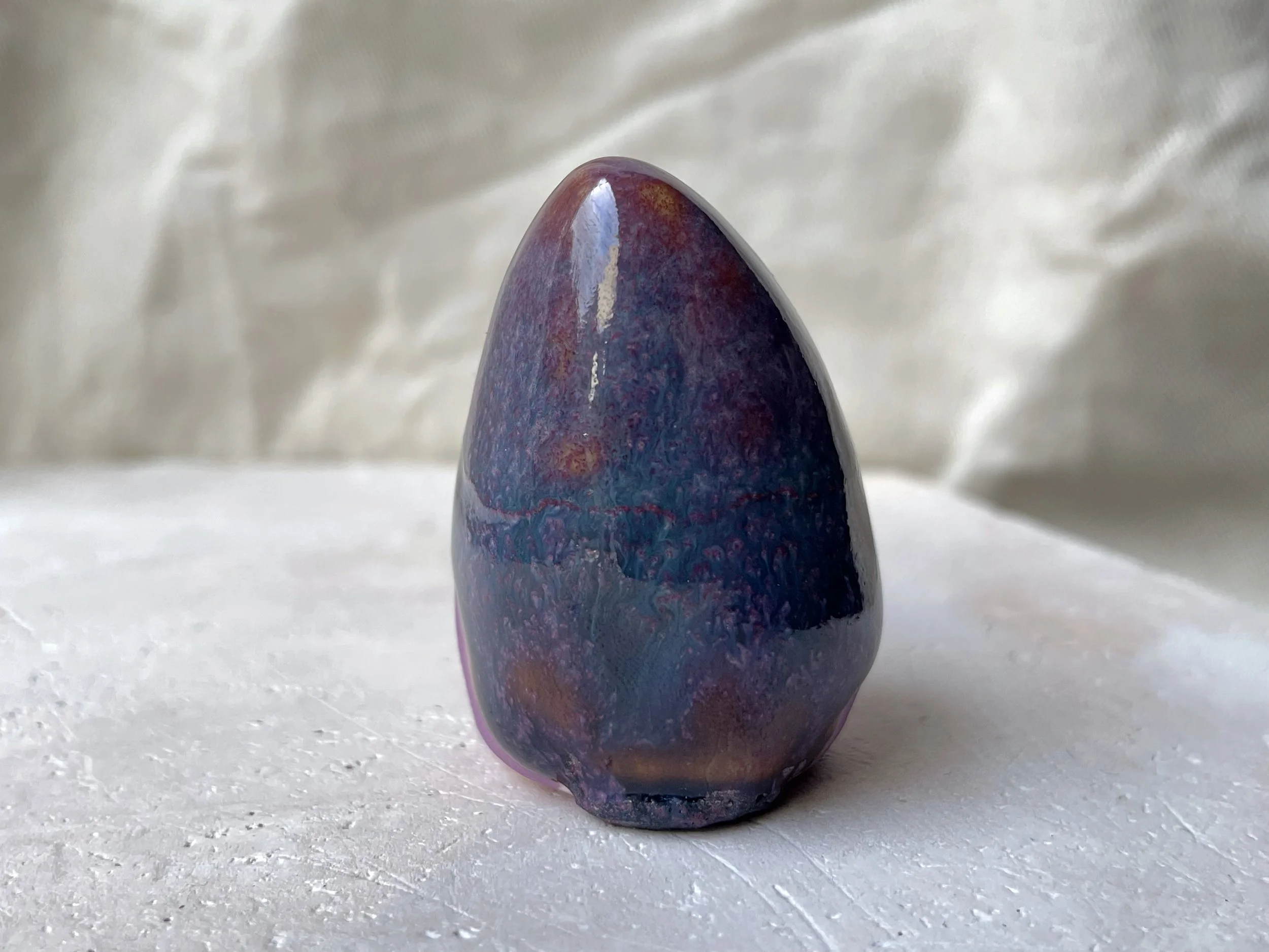 Purple, lilac and red handmade figurative ceramic sculpture with glossy drippy glaze