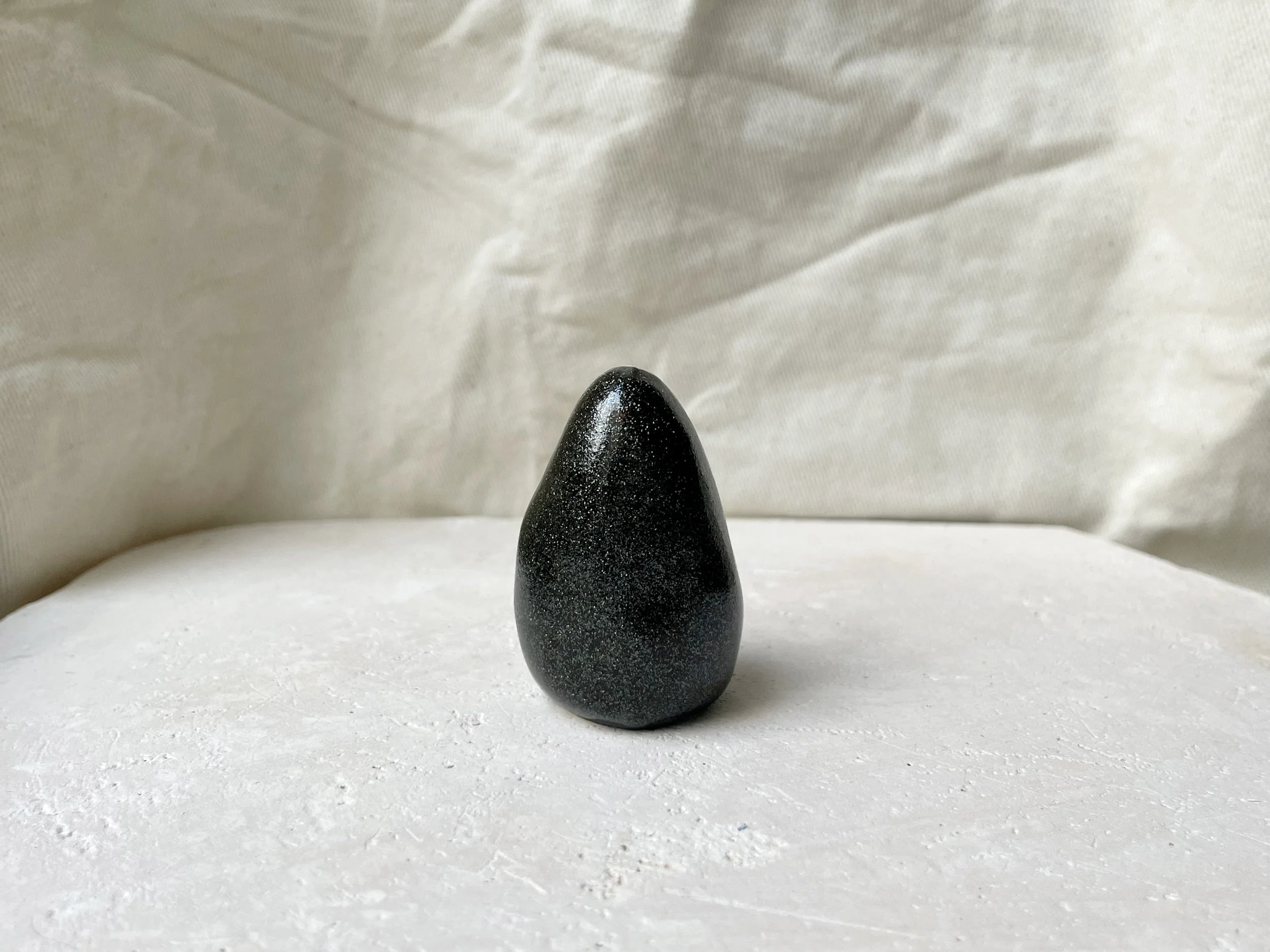 Black and white sparkly handmade figurative ceramic sculpture with glittery glaze