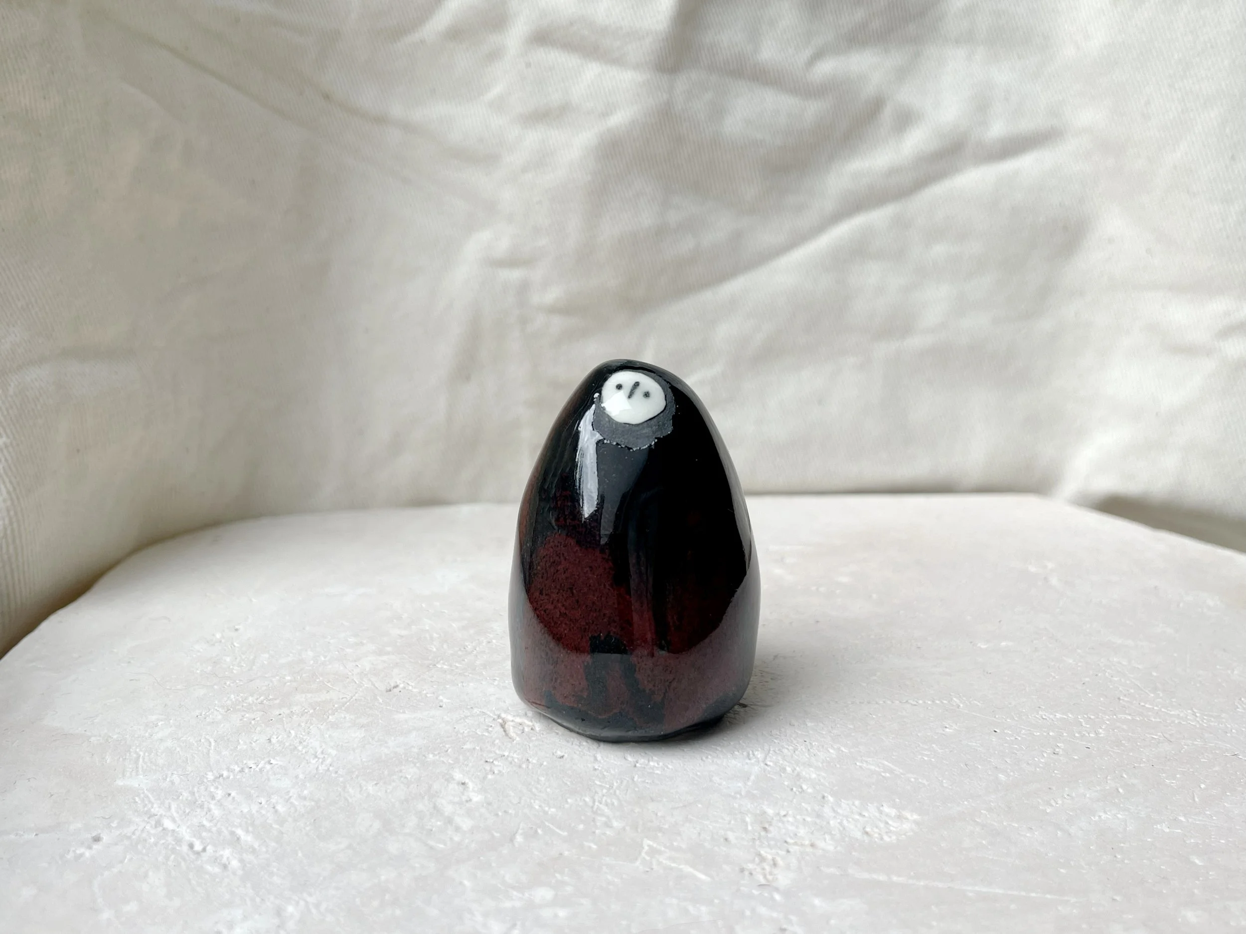 black and red handmade figurative ceramic sculpture with underglaze and floating glaze