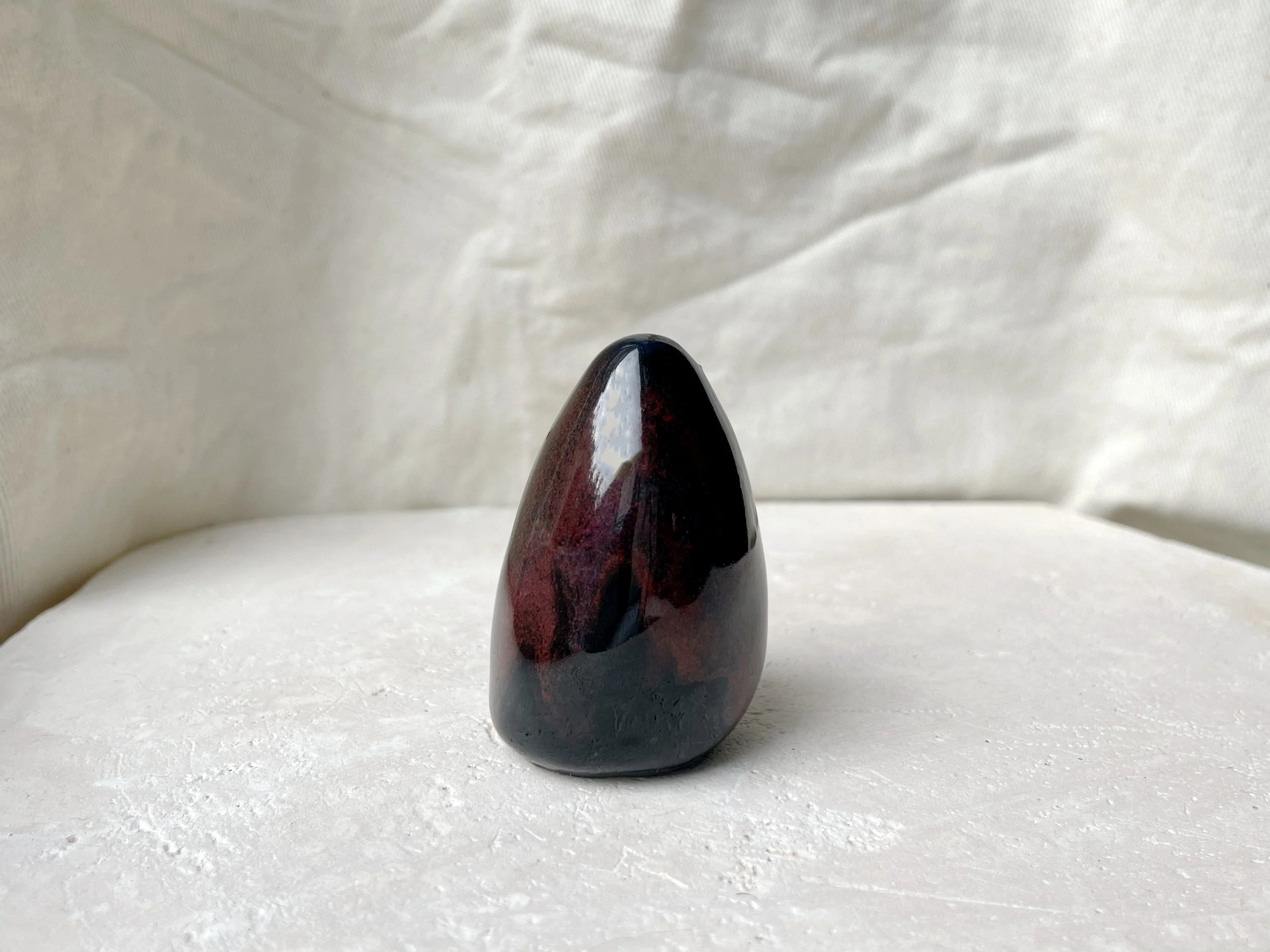 black and red handmade figurative ceramic sculpture with underglaze and floating glaze