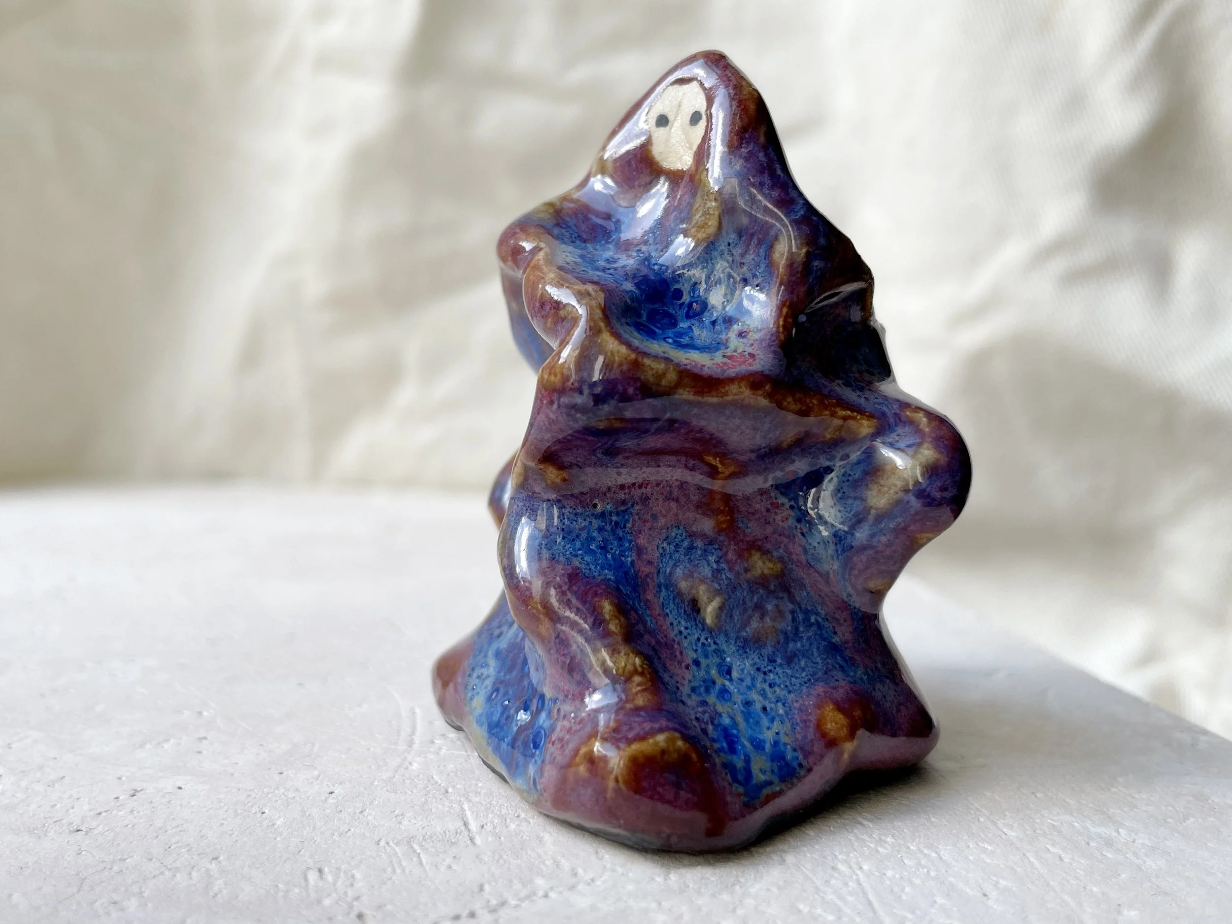 Blue, purple and red wavy handmade figurative ceramic sculpture with underglaze and runny glaze