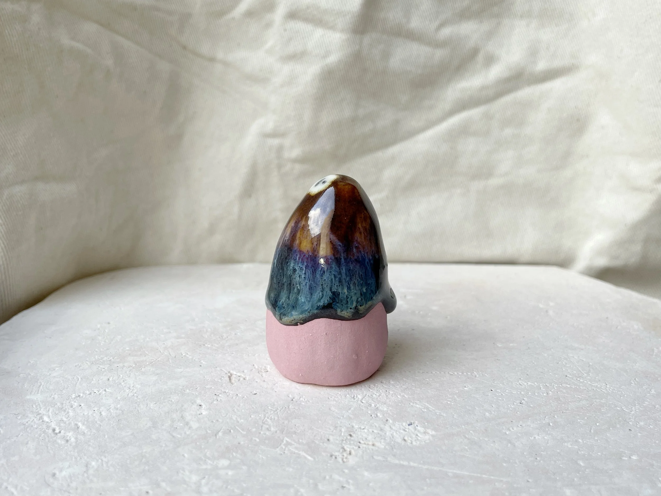 Pink, brown and green and cream handmade figurative ceramic sculpture with glossy drippy glaze