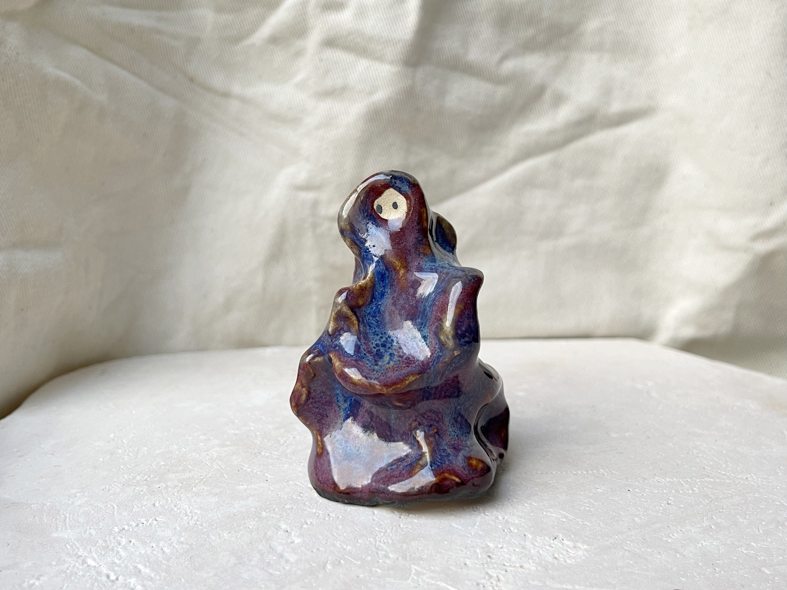 Wavy purple, red and blue handmade figurative ceramic sculpture with glossy floating glaze and underglaze