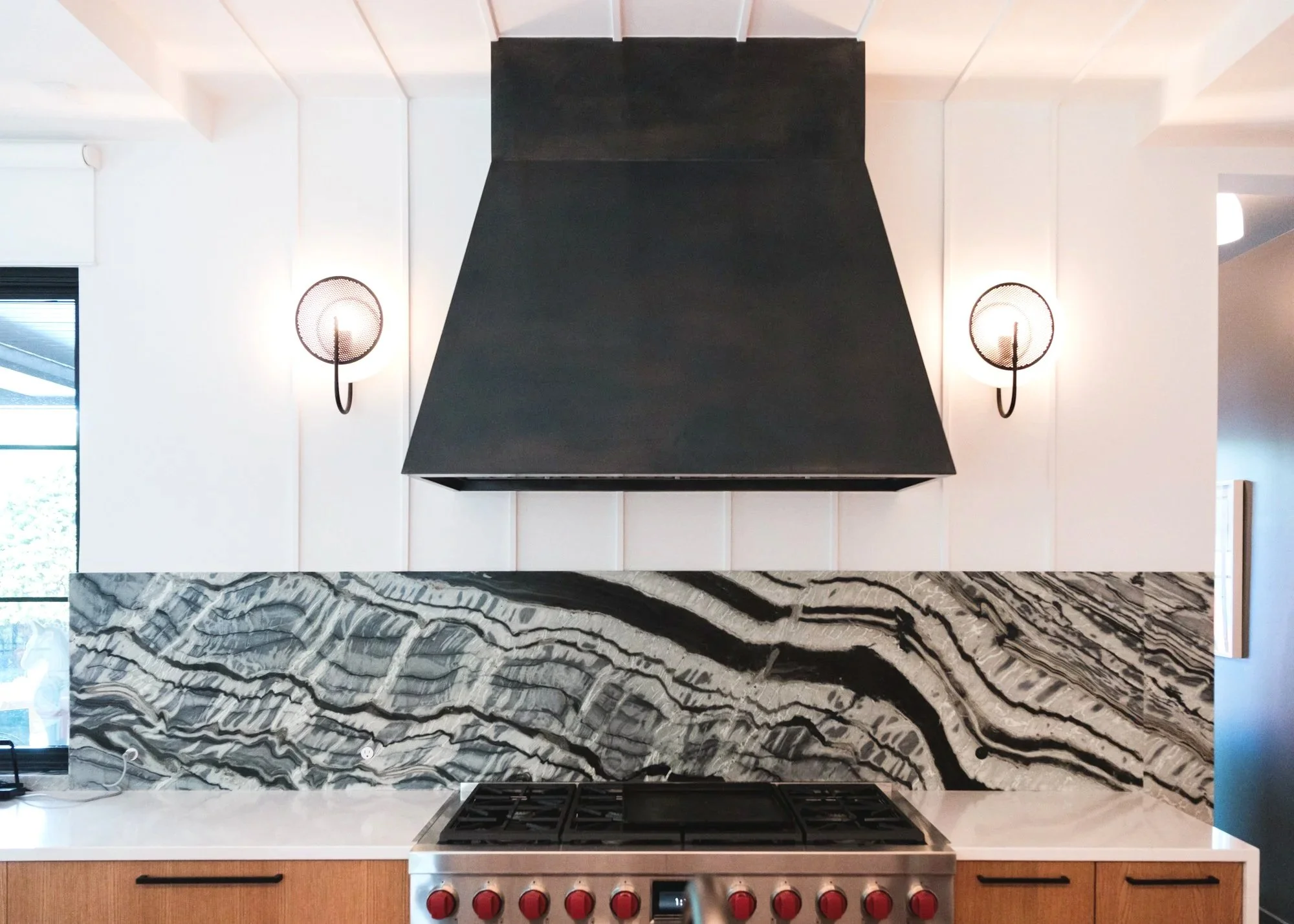 image of a geometric custom fabricated steel vent hood with patina in a kitchen in decatur, georgia made by james poulos of static sense design