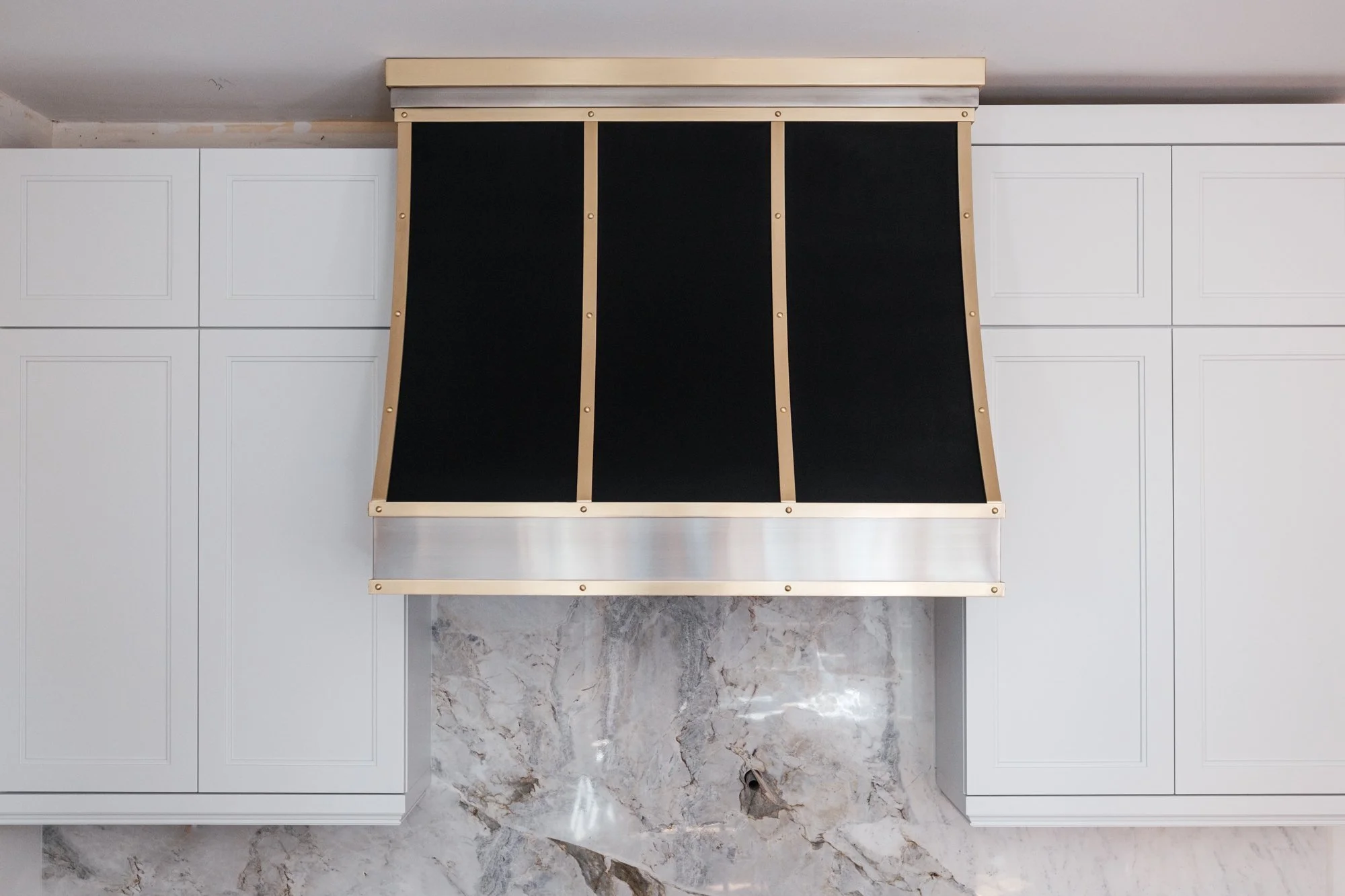 Custom stainless steel and brass vent hood by Static Sense