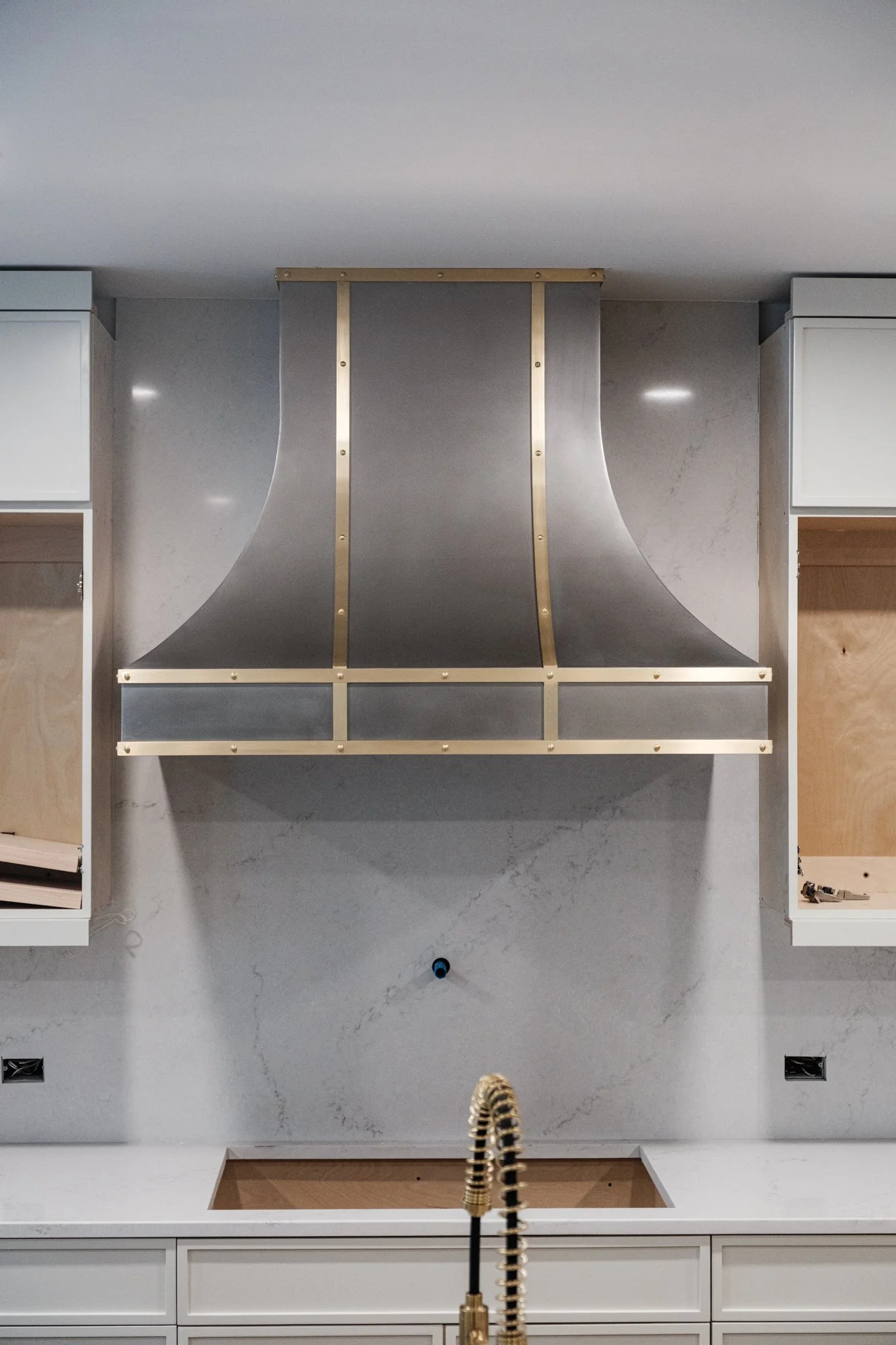 custom stainless steel and brass vent hood for home renovation in peachtree city