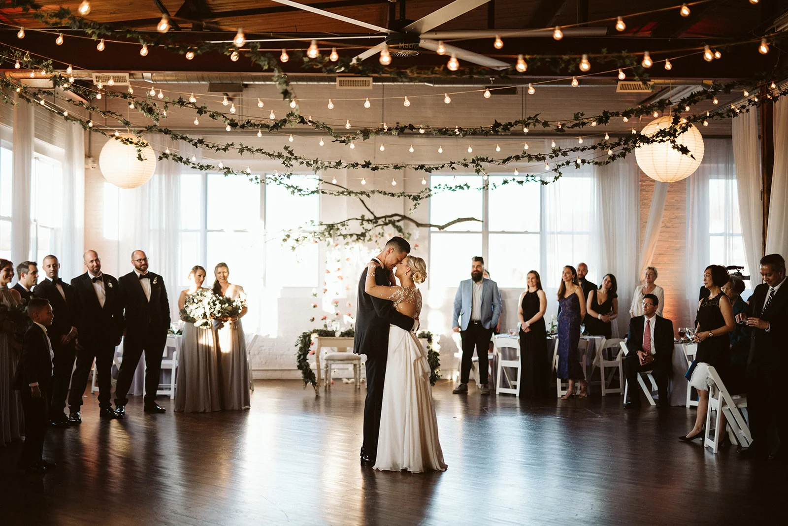 First dance in an art gallery at the Reading Art Works event venue near Philadelphia. The bride is wearing a gown by designer, Miss Haley Paige.