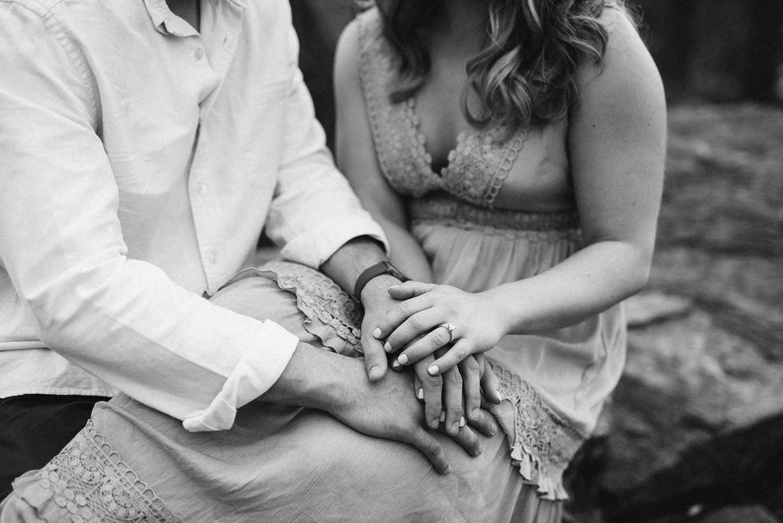 Black and white engagement ring detail photo.