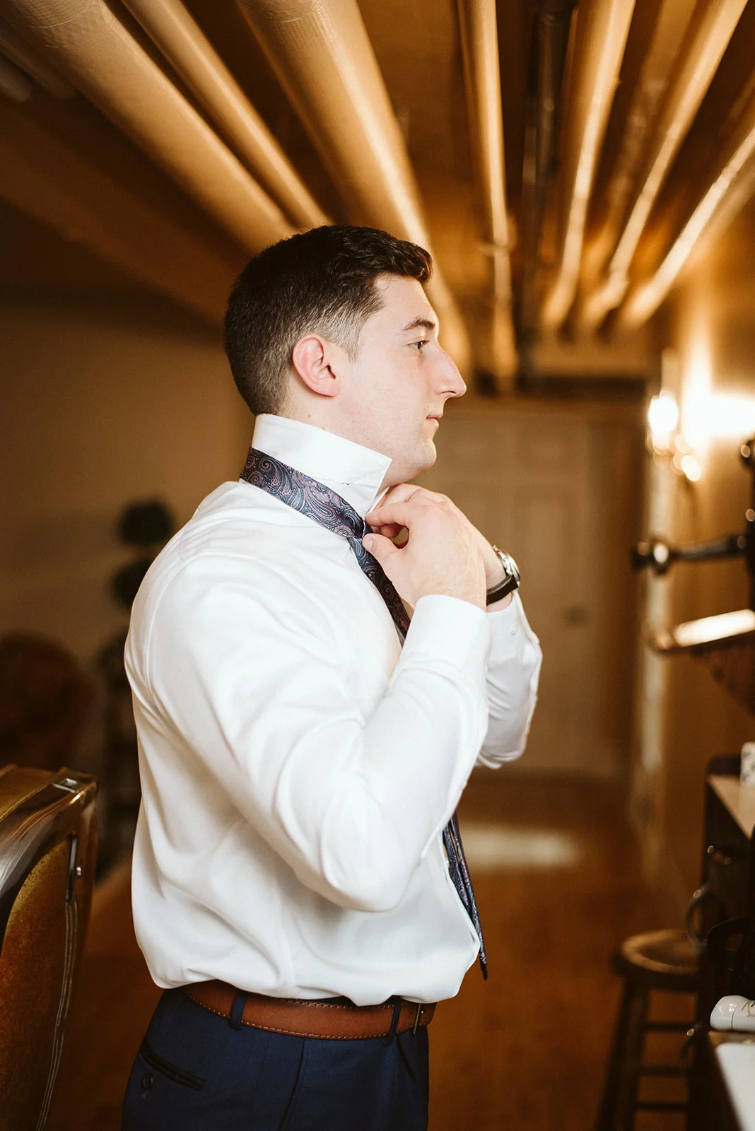 The groom is getting ready at Drumore Estate for his wedding.