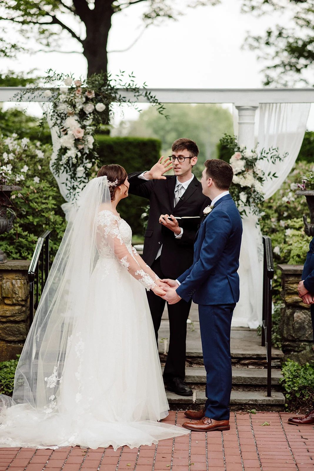 A bride and groom during their outdoor wedding ceremony at Drumore Estate.
