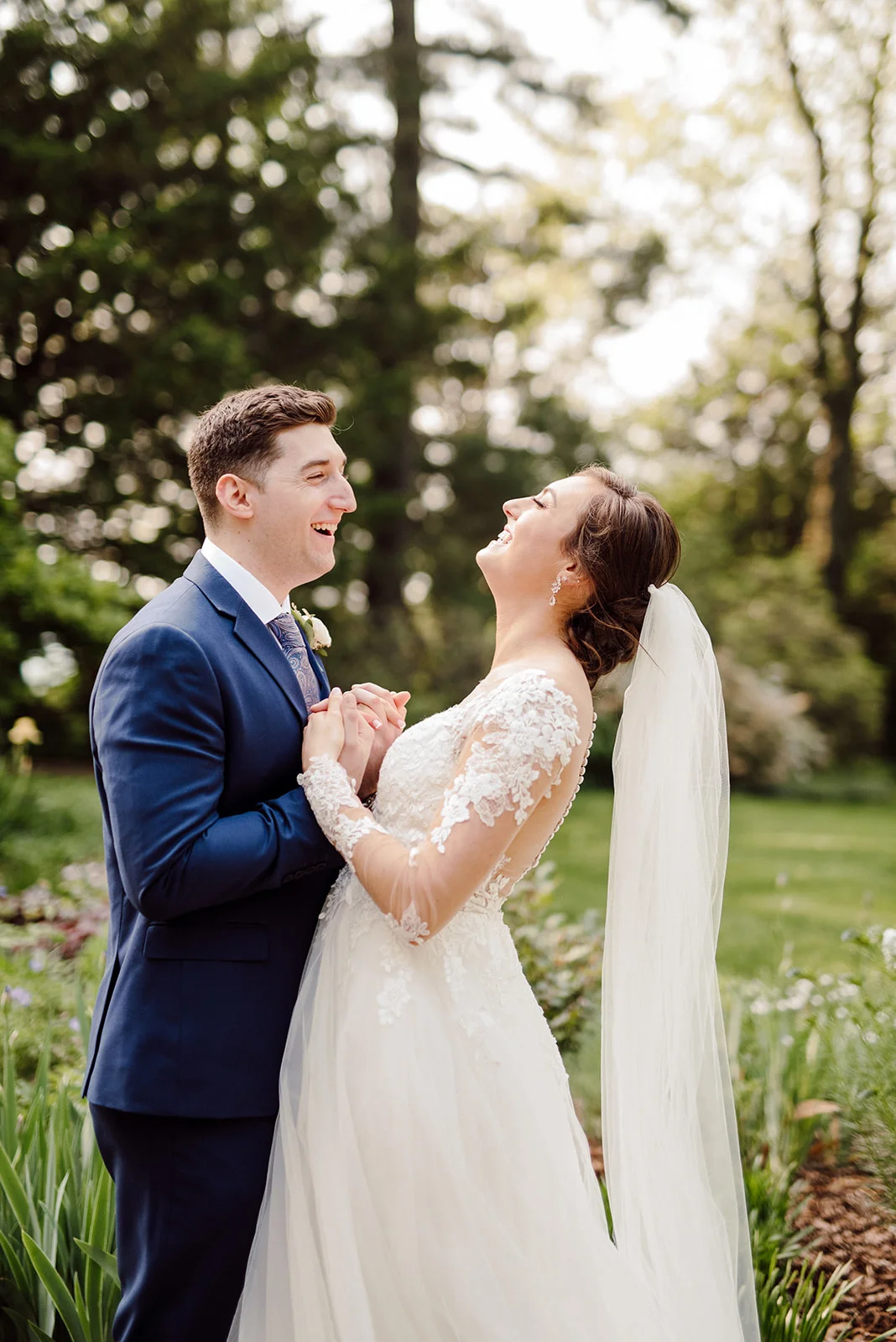 Bride and groom laughing with one another at Drumore Estate.