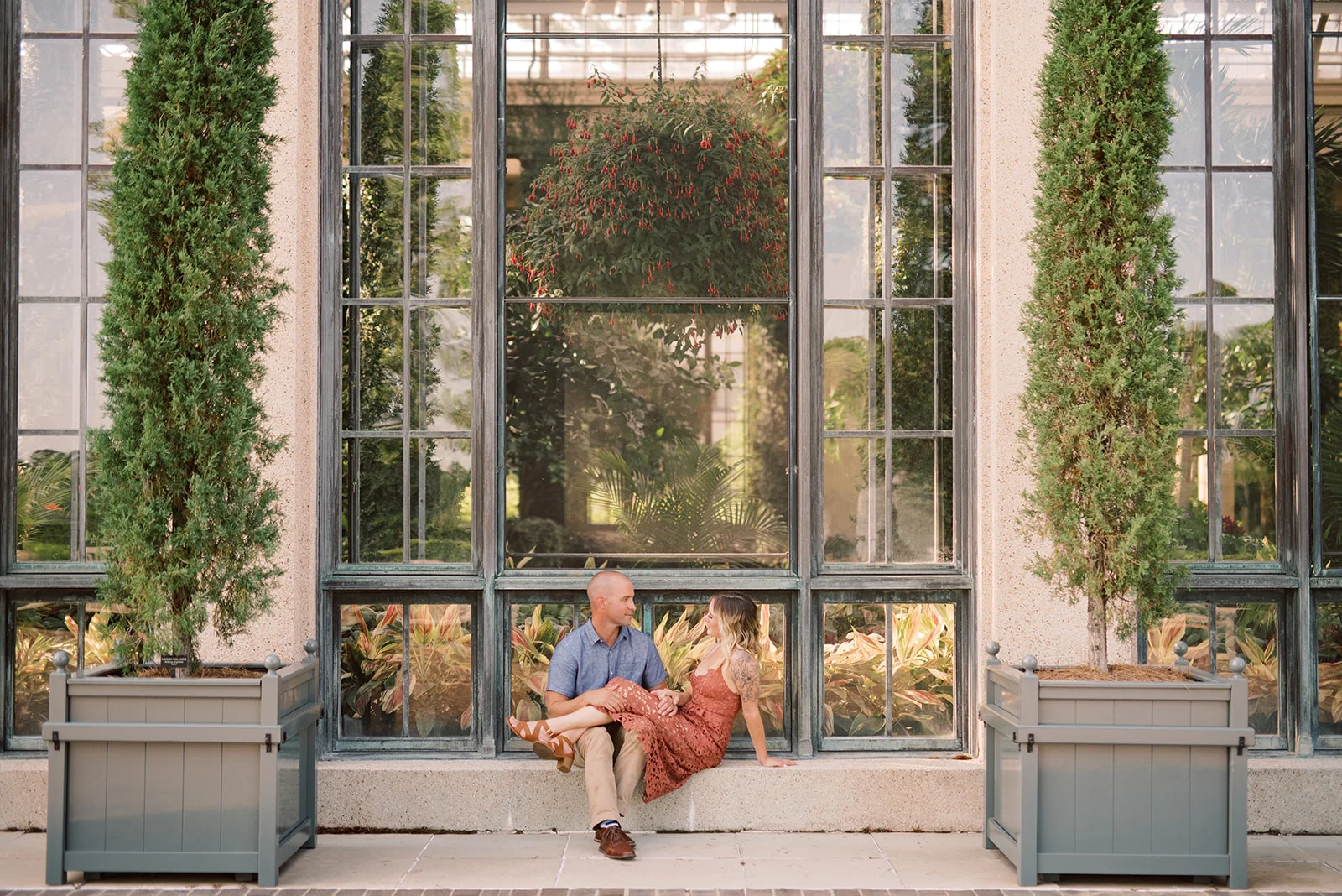 Taking engagement photos outside of the conservatory at Longwood Gardens.
