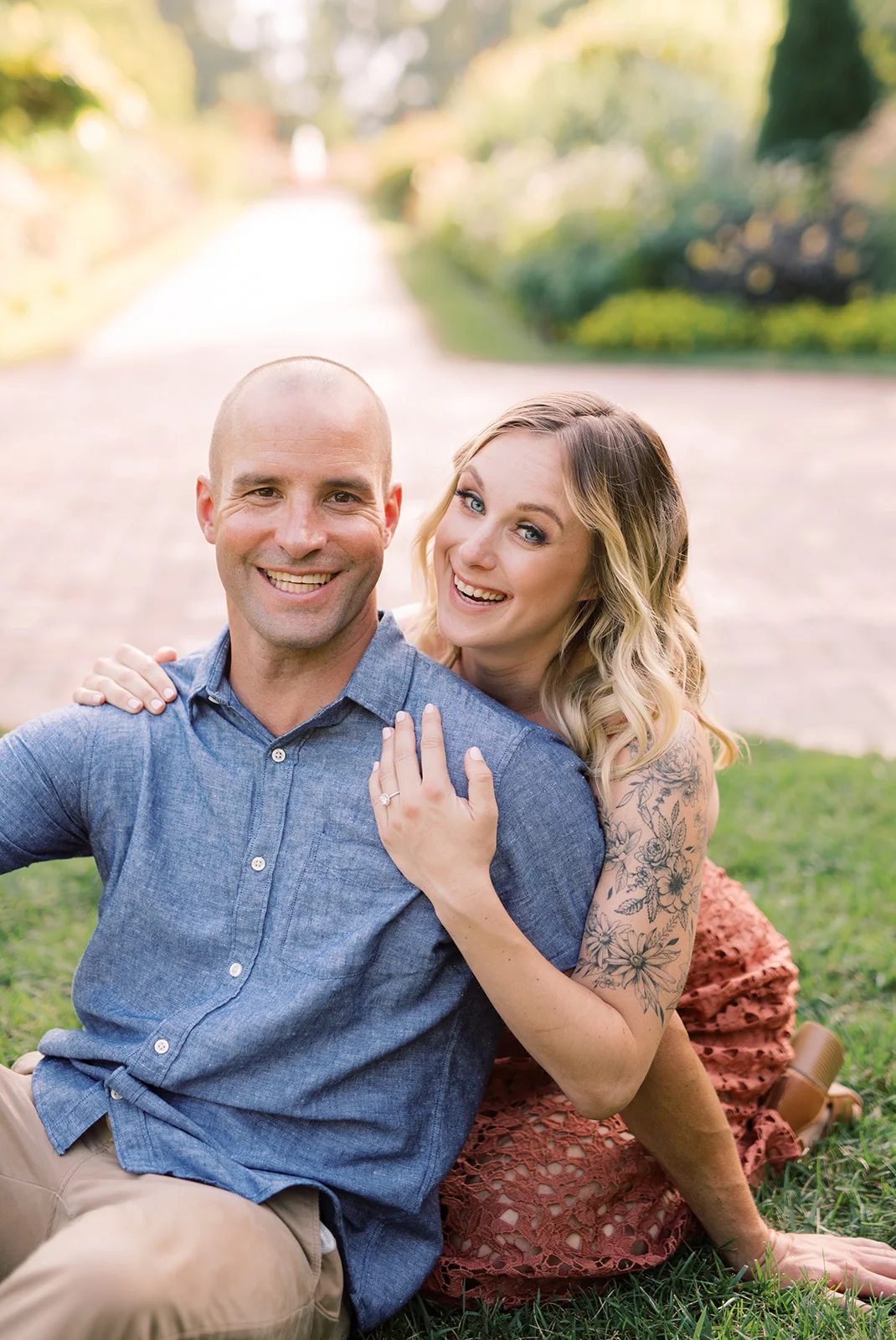 A couple laughs during their engagement session at Longwood Gardens.