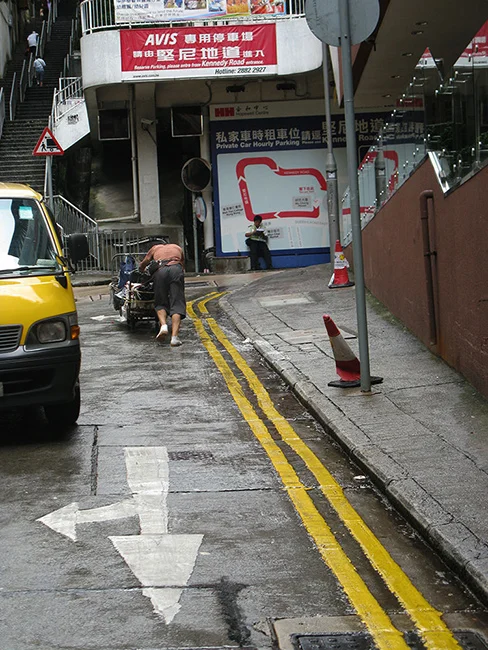 Hong-Kong-man-pushing-cart.jpg