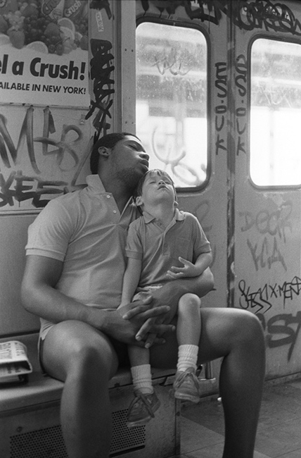Man-and-boy-sleeping-in-train.jpg