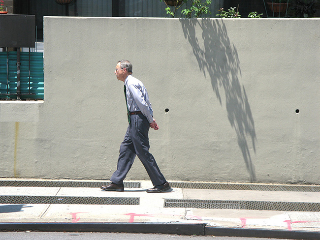Man-walking-hands-behind-back.jpg