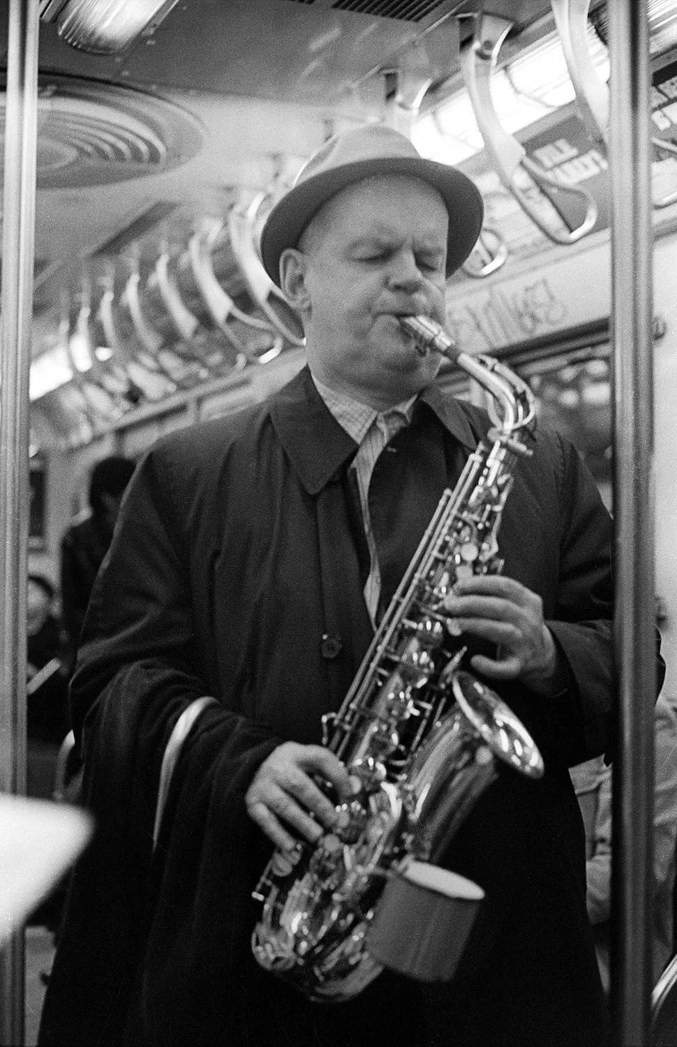Man-playing-saxaphone-in-train-web.jpg